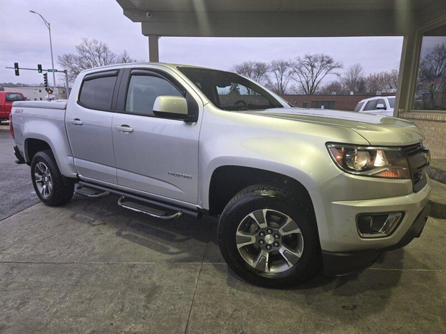 2015 Silver Ice Metallic /Black Chevrolet Colorado Z71 (1GCGTCE39F1) with an 3.6 engine, Automatic transmission, located at 25355 Eames Street, Channahon, IL, 60410, (815) 467-1807, 41.429108, -88.228432 - Introducing the 2015 Chevrolet Colorado Z71, a powerful and versatile pickup truck that boasts a 3.6-liter V6 engine. With its impressive performance and sleek design, this vehicle is perfect for those who demand both power and style. From the factory, the Colorado Z71 comes with a host of feature - Photo#0