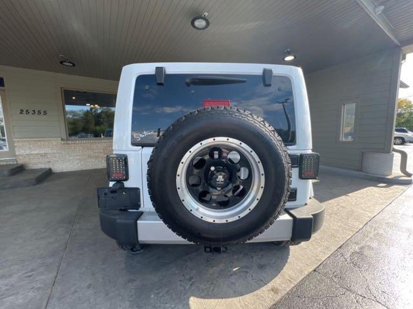 2017 Bright White Clear Coat Jeep Wrangler Unlimited Sahara (1C4HJWEG6HL) with an 3.6L V6 285hp 260ft. lbs. engine, Automatic transmission, located at 25355 Eames Street, Channahon, IL, 60410, (815) 467-1807, 41.429108, -88.228432 - CLEAN LOW MILE LOADED SAHARA! HEATED LEATHER! HARD TOP! If you're ready for a different, no hassle and pleasant car buying experience, then give us a chance! We're breaking the standard Car Sales mold and making one of our very own you'll be sure to appreciate! So, why buy from Crase Auto Connectio - Photo#4