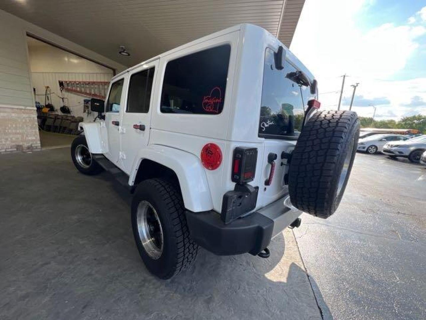 2017 Bright White Clear Coat Jeep Wrangler Unlimited Sahara (1C4HJWEG6HL) with an 3.6L V6 285hp 260ft. lbs. engine, Automatic transmission, located at 25355 Eames Street, Channahon, IL, 60410, (815) 467-1807, 41.429108, -88.228432 - CLEAN LOW MILE LOADED SAHARA! HEATED LEATHER! HARD TOP! If you're ready for a different, no hassle and pleasant car buying experience, then give us a chance! We're breaking the standard Car Sales mold and making one of our very own you'll be sure to appreciate! So, why buy from Crase Auto Connectio - Photo#5