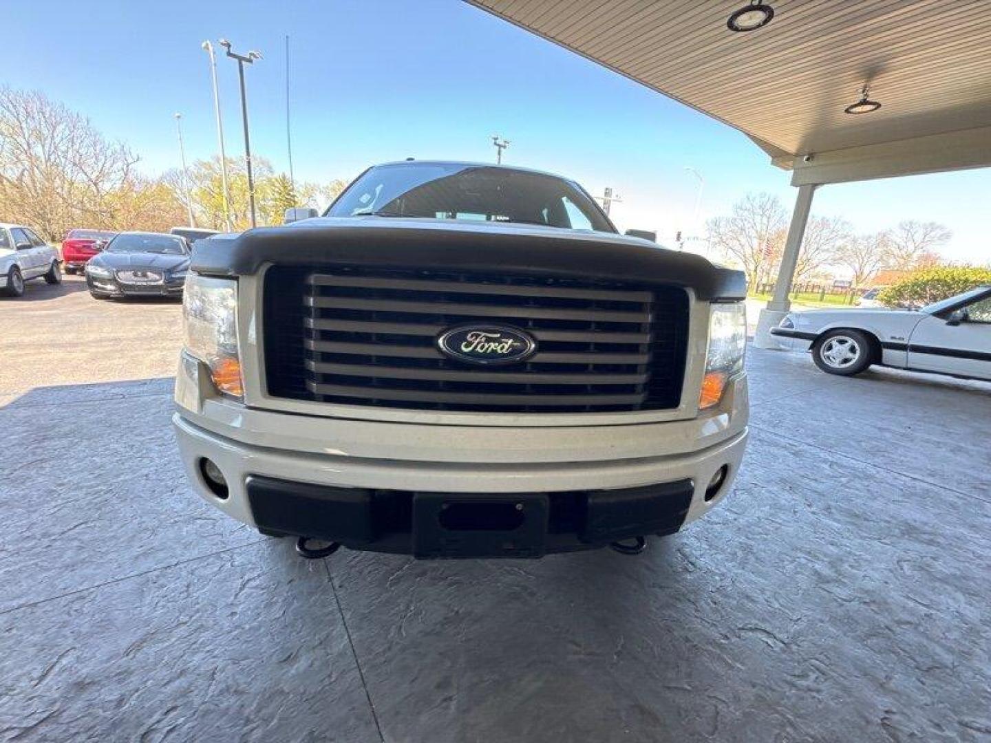 2011 Oxford White Ford F-150 FX4 (1FTFW1EF8BK) with an 5.0L Flex Fuel V8 360hp 380ft. lbs. engine, Automatic transmission, located at 25355 Eames Street, Channahon, IL, 60410, (815) 467-1807, 41.429108, -88.228432 - Looking for a truck that can handle your daily commute and your weekend adventures? Look no further than the 2011 Ford F-150 FX4! This beast is powered by a 5.0L Flex Fuel V8 engine that pumps out 360 horsepower and 380 foot-pounds of torque. And don't worry about stopping to fill up too often - it' - Photo#8