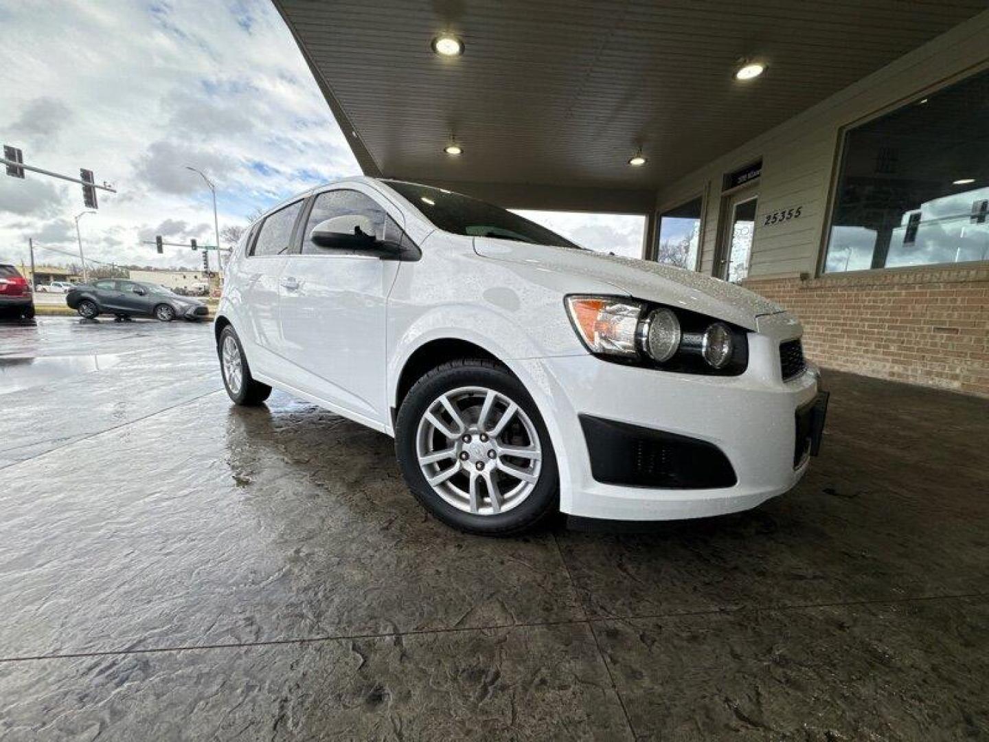 2015 Summit White Chevrolet Sonic LT (1G1JC6SBXF4) with an Ecotec 1.4L Turbo I4 138hp 148ft. lbs. engine, Automatic transmission, located at 25355 Eames Street, Channahon, IL, 60410, (815) 467-1807, 41.429108, -88.228432 - Looking for a car that's small but mighty? Look no further than the 2015 Chevrolet Sonic LT Auto! This bad boy is powered by an Ecotec 1.4L Turbo I4 engine that's just itching to hit the open road. With 138 horsepower and 148 foot-pounds of torque, you'll be zipping around town like a pro. But it's - Photo#0