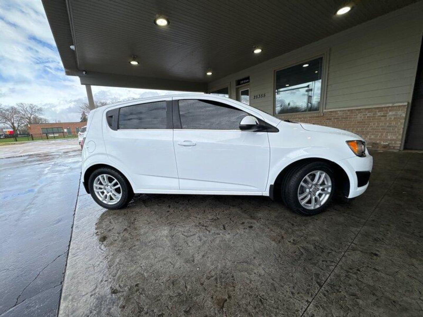 2015 Summit White Chevrolet Sonic LT (1G1JC6SBXF4) with an Ecotec 1.4L Turbo I4 138hp 148ft. lbs. engine, Automatic transmission, located at 25355 Eames Street, Channahon, IL, 60410, (815) 467-1807, 41.429108, -88.228432 - Looking for a car that's small but mighty? Look no further than the 2015 Chevrolet Sonic LT Auto! This bad boy is powered by an Ecotec 1.4L Turbo I4 engine that's just itching to hit the open road. With 138 horsepower and 148 foot-pounds of torque, you'll be zipping around town like a pro. But it's - Photo#1