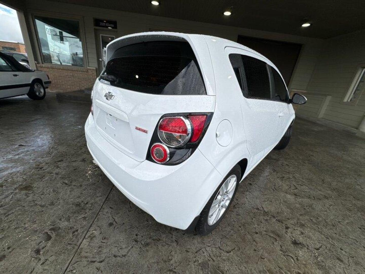 2015 Summit White Chevrolet Sonic LT (1G1JC6SBXF4) with an Ecotec 1.4L Turbo I4 138hp 148ft. lbs. engine, Automatic transmission, located at 25355 Eames Street, Channahon, IL, 60410, (815) 467-1807, 41.429108, -88.228432 - Looking for a car that's small but mighty? Look no further than the 2015 Chevrolet Sonic LT Auto! This bad boy is powered by an Ecotec 1.4L Turbo I4 engine that's just itching to hit the open road. With 138 horsepower and 148 foot-pounds of torque, you'll be zipping around town like a pro. But it's - Photo#3