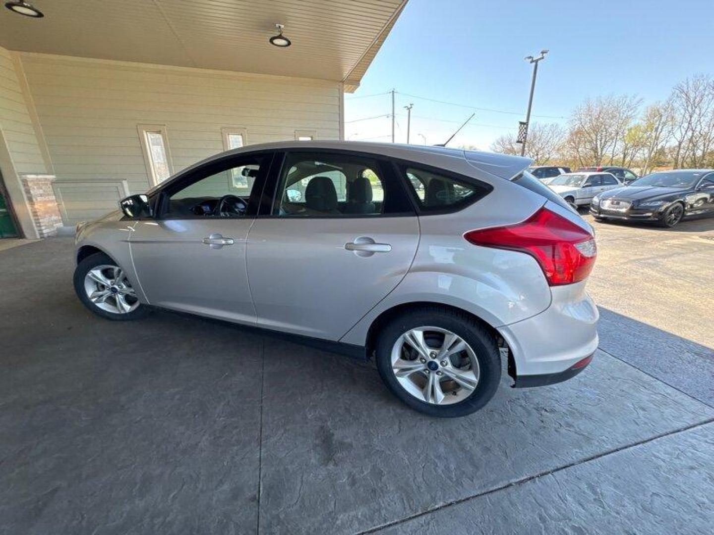 2014 Ingot Silver Metallic Ford Focus SE (1FADP3K27EL) with an 2.0L Flex Fuel I4 160hp 146ft. lbs. engine, Automatic transmission, located at 25355 Eames Street, Channahon, IL, 60410, (815) 467-1807, 41.429108, -88.228432 - Introducing the 2014 Ford Focus SE, an impressive compact car that boasts a powerful 2.0L Flex Fuel I4 engine, capable of delivering 160 horsepower and 146ft. lbs. of torque. With below 51,000 miles on the odometer, this vehicle has been driven less than 5,000 miles per year, making it a great optio - Photo#4