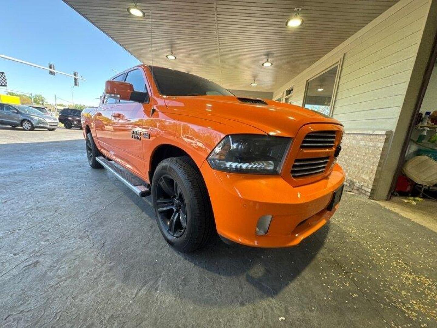 2015 Ignition Orange Clear Coat RAM 1500 Sport (1C6RR7MT9FS) with an HEMI 5.7L V8 395hp 410ft. lbs. engine, Automatic transmission, located at 25355 Eames Street, Channahon, IL, 60410, (815) 467-1807, 41.429108, -88.228432 - Looking for a truck that's got power for days and style to spare? Look no further than the 2015 RAM 1500 Sport! This bad boy is powered by a HEMI 5.7L V8 engine that delivers a whopping 395 horsepower and 410 foot-pounds of torque. That's right, you'll be able to haul just about anything you need wh - Photo#0