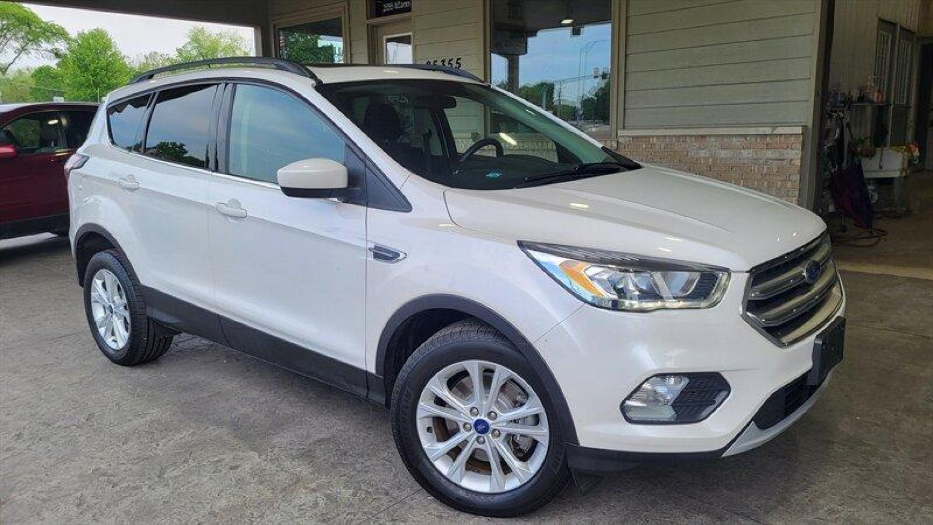 2017 Oxford White Ford Escape SE (1FMCU9G95HU) with an EcoBoost 2.0L Turbo I4 245hp 275ft. lbs. engine, Automatic transmission, located at 25355 Eames Street, Channahon, IL, 60410, (815) 467-1807, 41.429108, -88.228432 - Looking for a high-performing SUV that can handle anything life throws your way? Look no further than the 2017 Ford Escape SE! Powered by an impressive EcoBoost 2.0L Turbo I4 245hp 275ft. lbs. engine, this vehicle delivers a thrilling driving experience every time you hit the road. But that's not - Photo#0