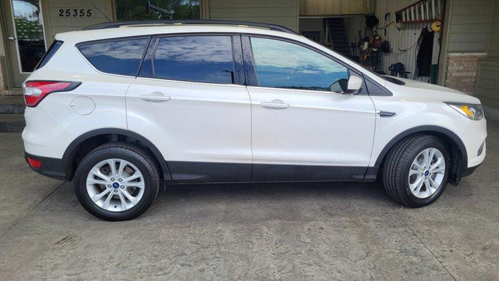 2017 Oxford White Ford Escape SE (1FMCU9G95HU) with an EcoBoost 2.0L Turbo I4 245hp 275ft. lbs. engine, Automatic transmission, located at 25355 Eames Street, Channahon, IL, 60410, (815) 467-1807, 41.429108, -88.228432 - Looking for a high-performing SUV that can handle anything life throws your way? Look no further than the 2017 Ford Escape SE! Powered by an impressive EcoBoost 2.0L Turbo I4 245hp 275ft. lbs. engine, this vehicle delivers a thrilling driving experience every time you hit the road. But that's not - Photo#1