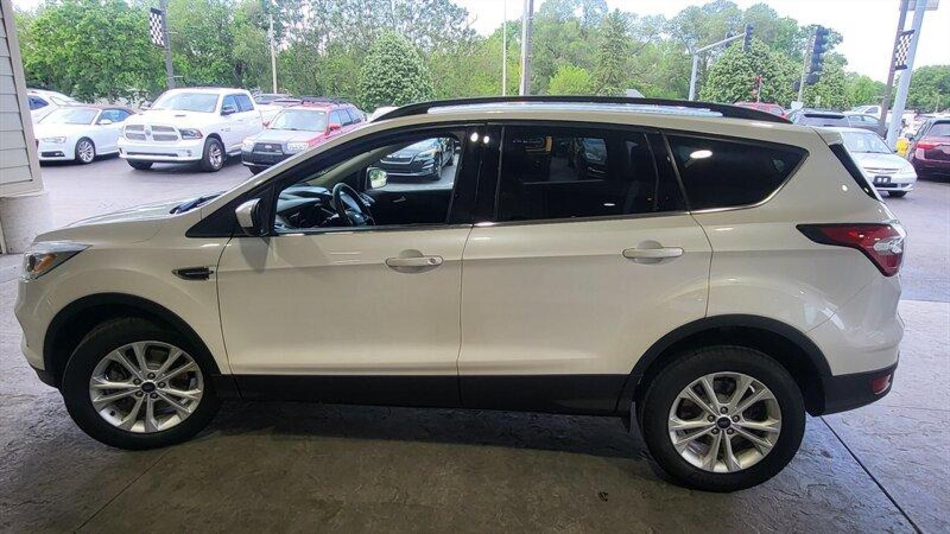 2017 Oxford White Ford Escape SE (1FMCU9G95HU) with an EcoBoost 2.0L Turbo I4 245hp 275ft. lbs. engine, Automatic transmission, located at 25355 Eames Street, Channahon, IL, 60410, (815) 467-1807, 41.429108, -88.228432 - Looking for a high-performing SUV that can handle anything life throws your way? Look no further than the 2017 Ford Escape SE! Powered by an impressive EcoBoost 2.0L Turbo I4 245hp 275ft. lbs. engine, this vehicle delivers a thrilling driving experience every time you hit the road. But that's not - Photo#6