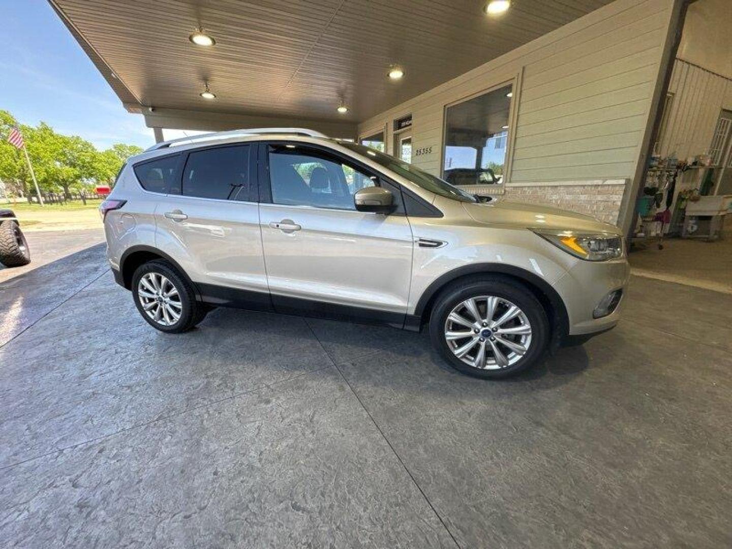 2017 White Gold Ford Escape Titanium (1FMCU0J96HU) with an 2.0 engine, Automatic transmission, located at 25355 Eames Street, Channahon, IL, 60410, (815) 467-1807, 41.429108, -88.228432 - Looking for an SUV that's tough, stylish, and fast? Look no further than the 2017 Ford Escape Titanium! This baby is powered by a 2.0 engine that will have you zooming down the road like nobody's business. But that's not all - this ride is loaded with factory default features that will make your jaw - Photo#1