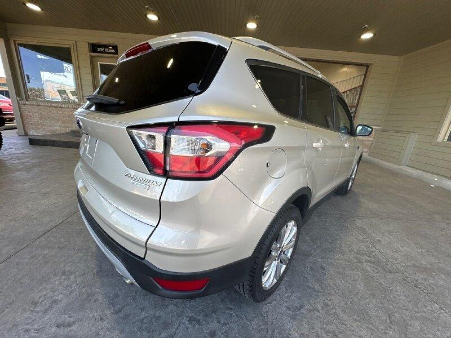 2017 White Gold Ford Escape Titanium (1FMCU0J96HU) with an 2.0 engine, Automatic transmission, located at 25355 Eames Street, Channahon, IL, 60410, (815) 467-1807, 41.429108, -88.228432 - Looking for an SUV that's tough, stylish, and fast? Look no further than the 2017 Ford Escape Titanium! This baby is powered by a 2.0 engine that will have you zooming down the road like nobody's business. But that's not all - this ride is loaded with factory default features that will make your jaw - Photo#3