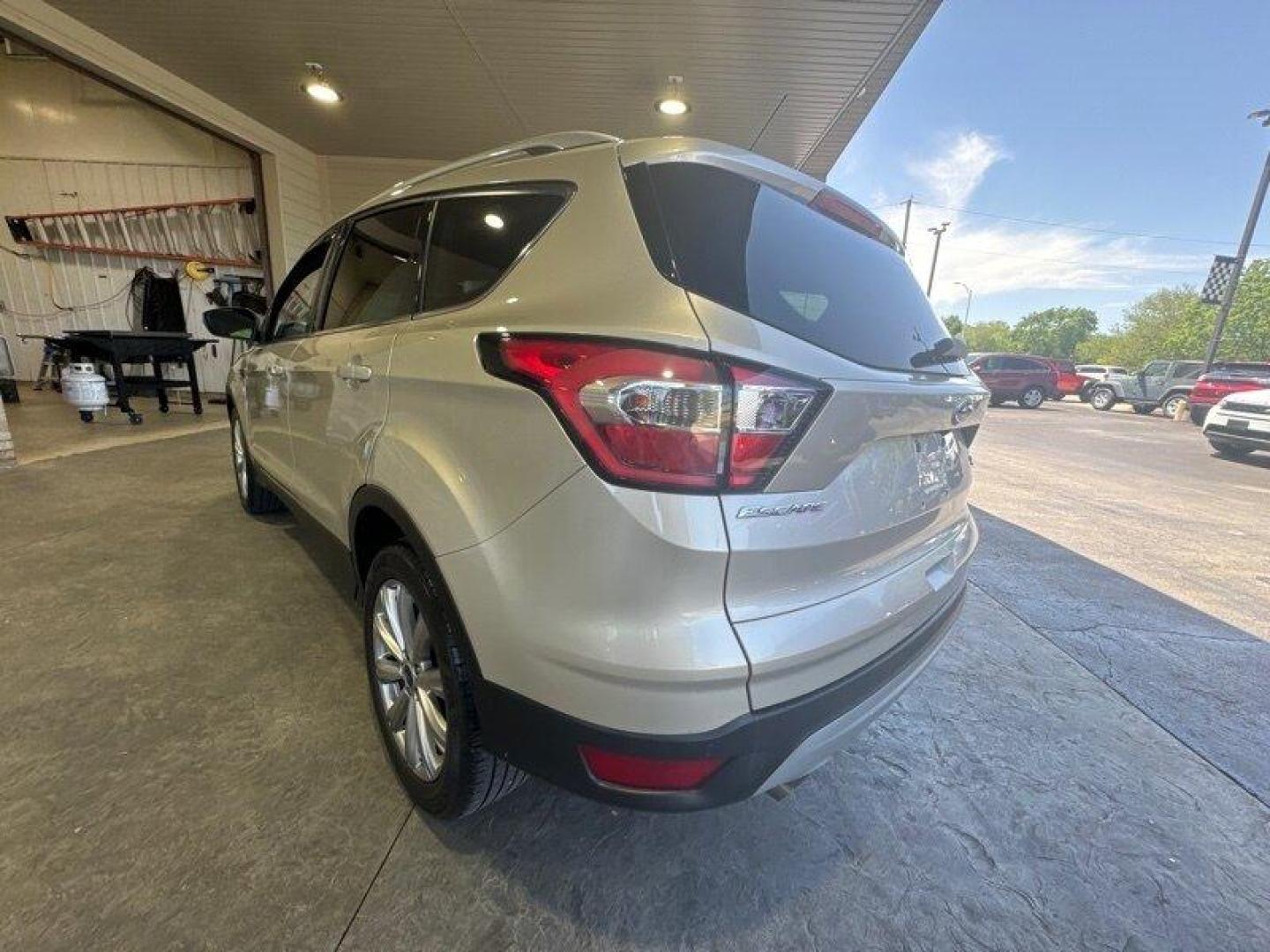 2017 White Gold Ford Escape Titanium (1FMCU0J96HU) with an 2.0 engine, Automatic transmission, located at 25355 Eames Street, Channahon, IL, 60410, (815) 467-1807, 41.429108, -88.228432 - Looking for an SUV that's tough, stylish, and fast? Look no further than the 2017 Ford Escape Titanium! This baby is powered by a 2.0 engine that will have you zooming down the road like nobody's business. But that's not all - this ride is loaded with factory default features that will make your jaw - Photo#5