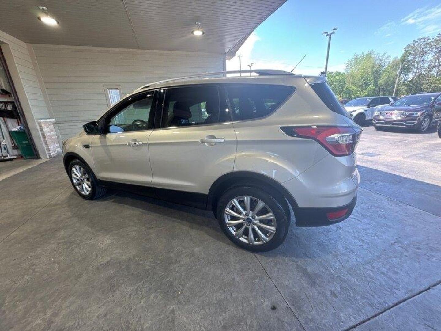 2017 White Gold Ford Escape Titanium (1FMCU0J96HU) with an 2.0 engine, Automatic transmission, located at 25355 Eames Street, Channahon, IL, 60410, (815) 467-1807, 41.429108, -88.228432 - Looking for an SUV that's tough, stylish, and fast? Look no further than the 2017 Ford Escape Titanium! This baby is powered by a 2.0 engine that will have you zooming down the road like nobody's business. But that's not all - this ride is loaded with factory default features that will make your jaw - Photo#6