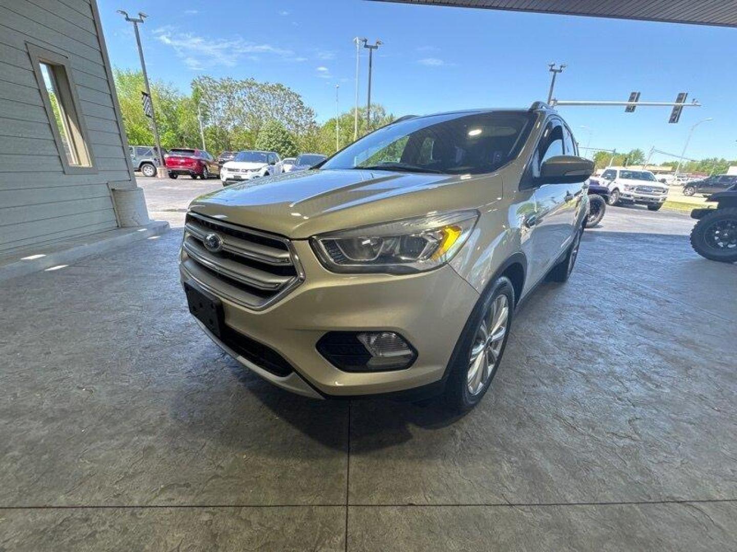 2017 White Gold Ford Escape Titanium (1FMCU0J96HU) with an 2.0 engine, Automatic transmission, located at 25355 Eames Street, Channahon, IL, 60410, (815) 467-1807, 41.429108, -88.228432 - Looking for an SUV that's tough, stylish, and fast? Look no further than the 2017 Ford Escape Titanium! This baby is powered by a 2.0 engine that will have you zooming down the road like nobody's business. But that's not all - this ride is loaded with factory default features that will make your jaw - Photo#7