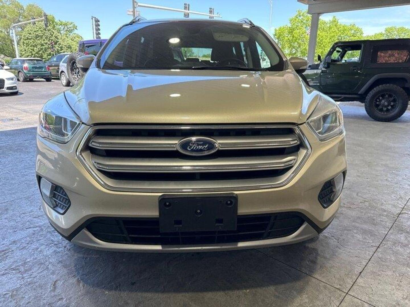 2017 White Gold Ford Escape Titanium (1FMCU0J96HU) with an 2.0 engine, Automatic transmission, located at 25355 Eames Street, Channahon, IL, 60410, (815) 467-1807, 41.429108, -88.228432 - Looking for an SUV that's tough, stylish, and fast? Look no further than the 2017 Ford Escape Titanium! This baby is powered by a 2.0 engine that will have you zooming down the road like nobody's business. But that's not all - this ride is loaded with factory default features that will make your jaw - Photo#8