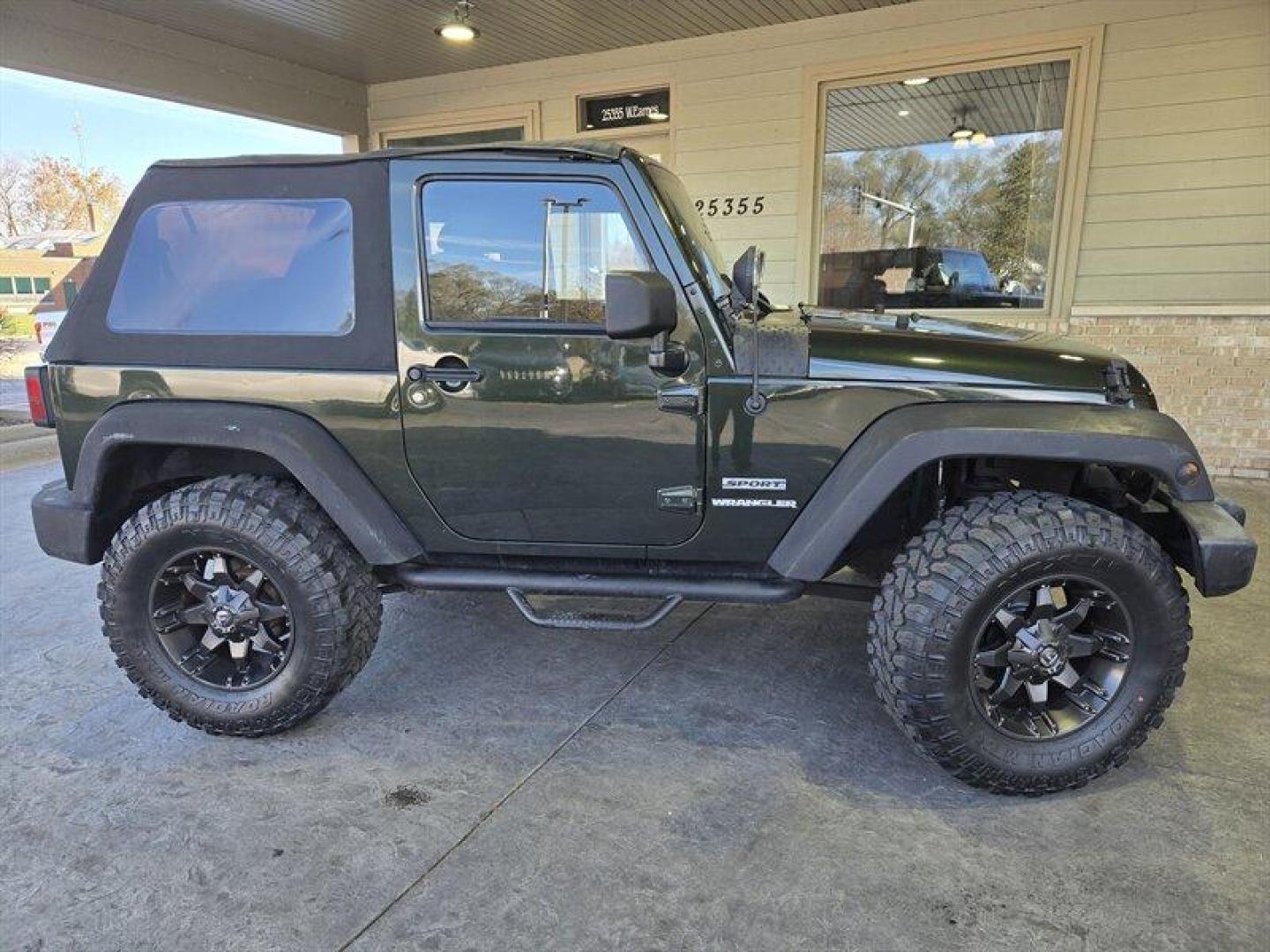 2011 Natural Green Pearl Coat Jeep Wrangler Sport (1J4AA2D15BL) with an 3.8L V6 202hp 237ft. lbs. engine, 6 Speed Manual transmission, located at 25355 Eames Street, Channahon, IL, 60410, (815) 467-1807, 41.429108, -88.228432 - *ART ON HOOD IS PAINTED NOT A WRAP* Ladies and gentlemen, feast your eyes on the ultimate adventurer's dream machine - the 2011 Jeep Wrangler Sport! This bad boy is powered by a 3.8L V6 engine that pumps out an impressive 202 horses and 237 lb-ft of torque. That means you'll be able to climb over m - Photo#1