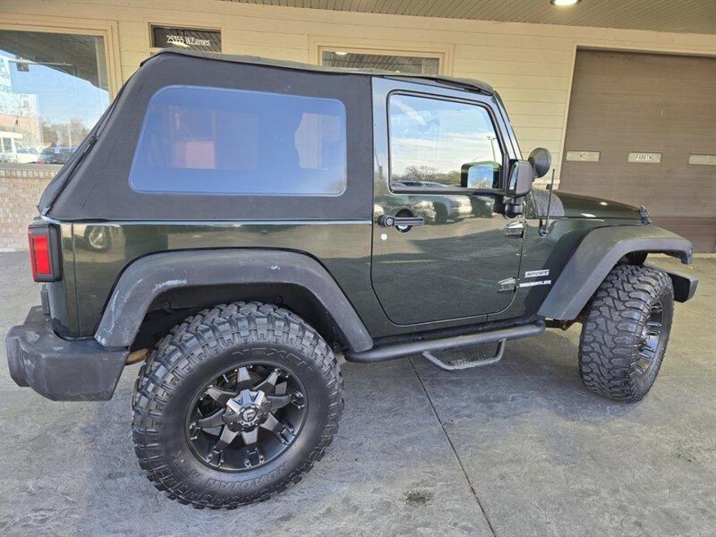 2011 Natural Green Pearl Coat Jeep Wrangler Sport (1J4AA2D15BL) with an 3.8L V6 202hp 237ft. lbs. engine, 6 Speed Manual transmission, located at 25355 Eames Street, Channahon, IL, 60410, (815) 467-1807, 41.429108, -88.228432 - *ART ON HOOD IS PAINTED NOT A WRAP* Ladies and gentlemen, feast your eyes on the ultimate adventurer's dream machine - the 2011 Jeep Wrangler Sport! This bad boy is powered by a 3.8L V6 engine that pumps out an impressive 202 horses and 237 lb-ft of torque. That means you'll be able to climb over m - Photo#2