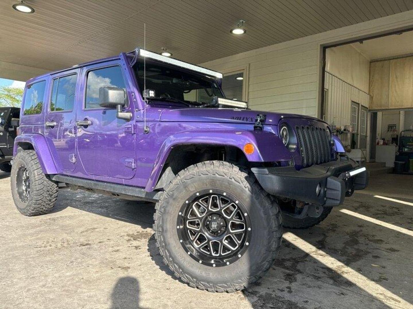 2016 Purple Jeep Wrangler Unlimited Sahara (1C4BJWEG3GL) with an 3.6L V6 285hp 260ft. lbs. engine, Automatic transmission, located at 25355 Eames Street, Channahon, IL, 60410, (815) 467-1807, 41.429108, -88.228432 - Looking for a vehicle that's as tough as it is stylish? Look no further than the 2016 Jeep Wrangler Unlimited Sahara Back Country! This rugged SUV is powered by a powerful 3.6L V6 engine that delivers an impressive 285hp and 260ft. lbs. of torque, giving you the power you need to tackle any terrain. - Photo#0