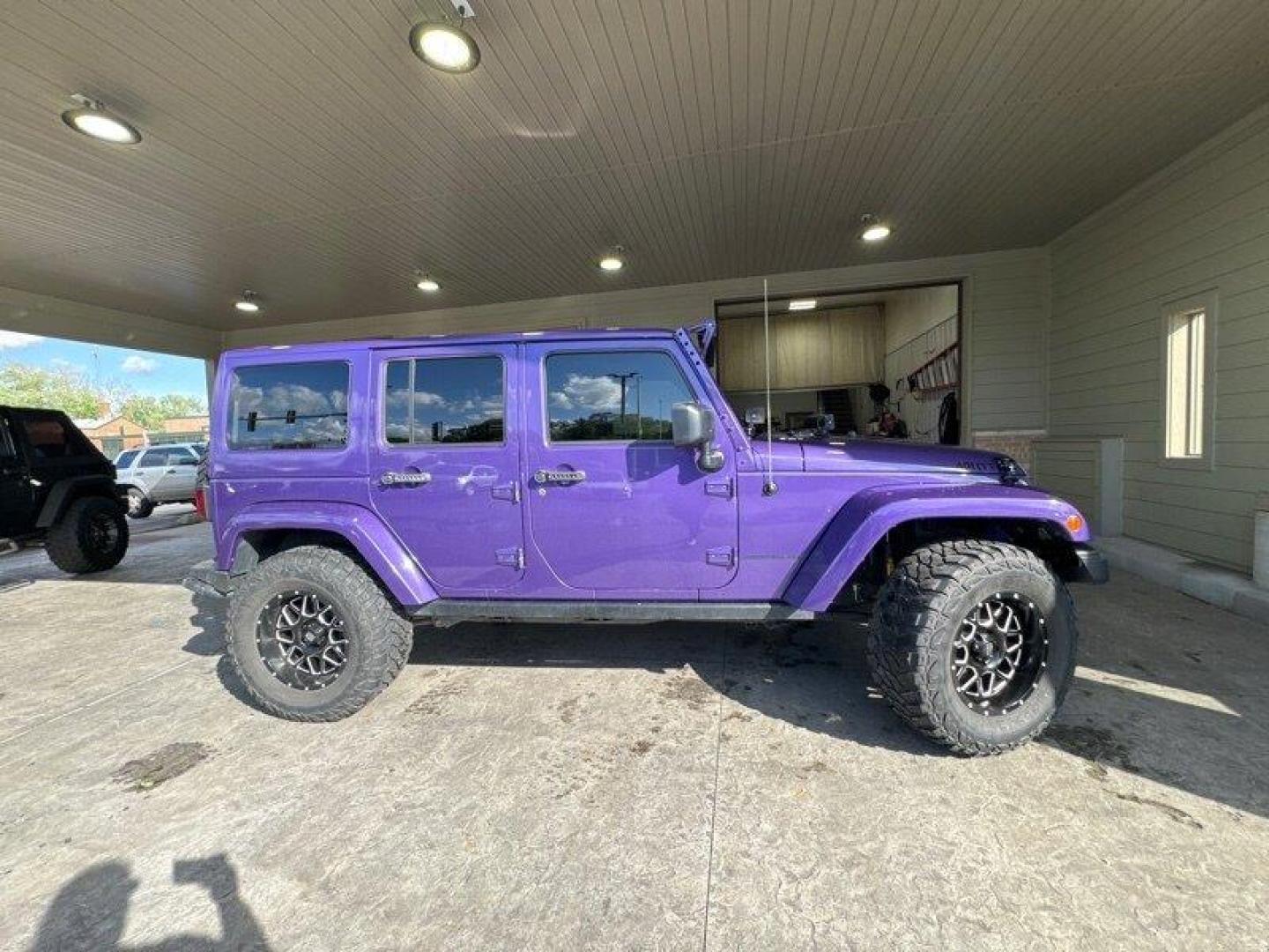 2016 Purple Jeep Wrangler Unlimited Sahara (1C4BJWEG3GL) with an 3.6L V6 285hp 260ft. lbs. engine, Automatic transmission, located at 25355 Eames Street, Channahon, IL, 60410, (815) 467-1807, 41.429108, -88.228432 - Looking for a vehicle that's as tough as it is stylish? Look no further than the 2016 Jeep Wrangler Unlimited Sahara Back Country! This rugged SUV is powered by a powerful 3.6L V6 engine that delivers an impressive 285hp and 260ft. lbs. of torque, giving you the power you need to tackle any terrain. - Photo#1