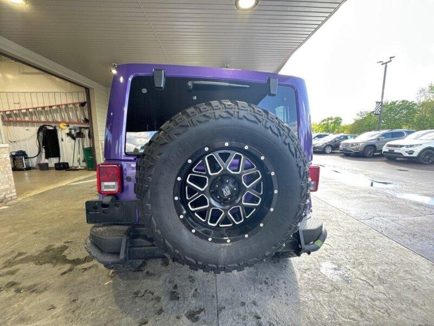 2016 Purple Jeep Wrangler Unlimited Sahara (1C4BJWEG3GL) with an 3.6L V6 285hp 260ft. lbs. engine, Automatic transmission, located at 25355 Eames Street, Channahon, IL, 60410, (815) 467-1807, 41.429108, -88.228432 - Looking for a vehicle that's as tough as it is stylish? Look no further than the 2016 Jeep Wrangler Unlimited Sahara Back Country! This rugged SUV is powered by a powerful 3.6L V6 engine that delivers an impressive 285hp and 260ft. lbs. of torque, giving you the power you need to tackle any terrain. - Photo#4