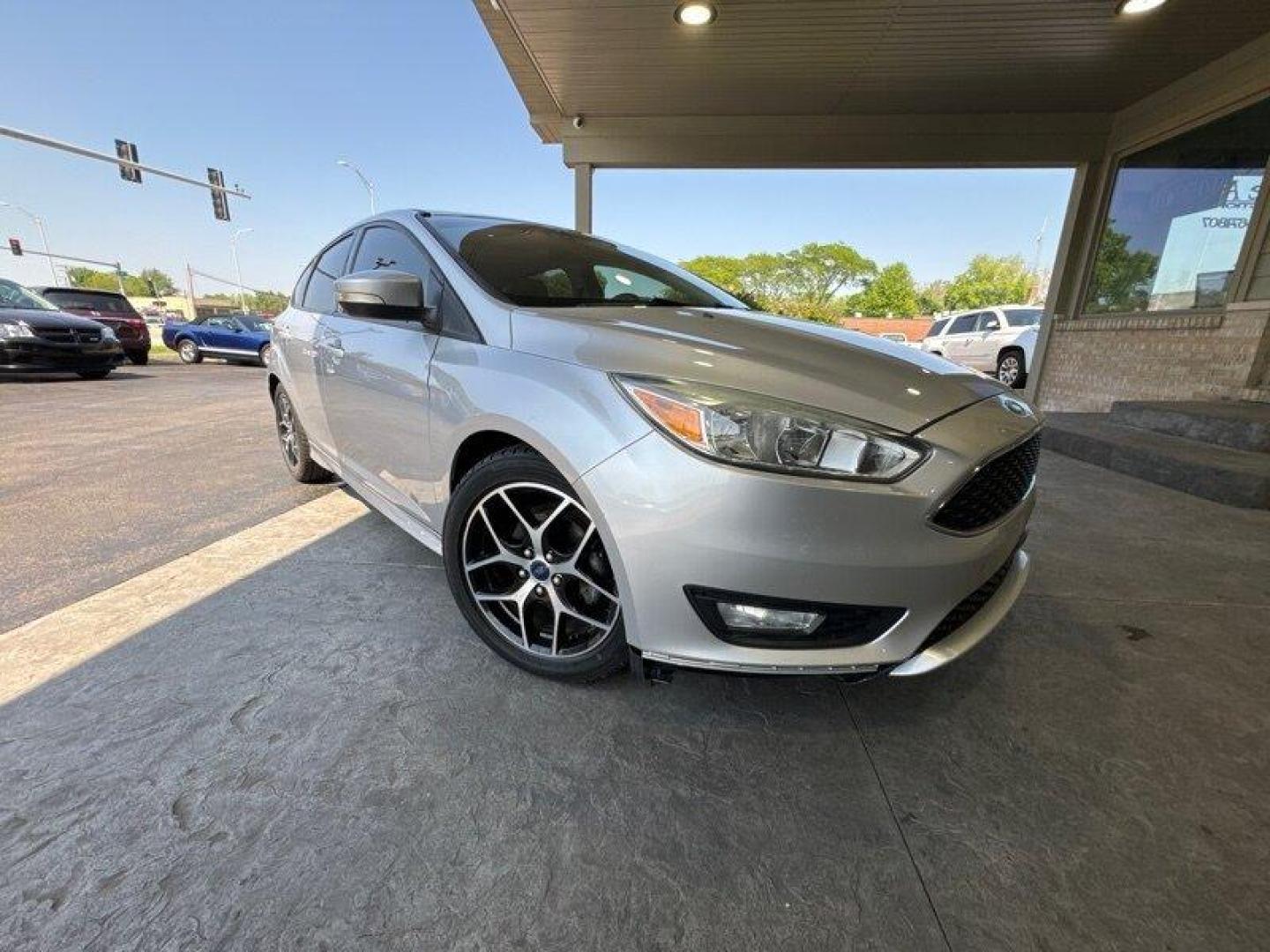 2015 Ingot Silver Ford Focus SE (1FADP3K20FL) with an 2.0L Flex Fuel I4 160hp 146ft. lbs. engine, Automatic transmission, located at 25355 Eames Street, Channahon, IL, 60410, (815) 467-1807, 41.429108, -88.228432 - Looking for a car that's powerful, stylish, and packed with features? Look no further than the 2015 Ford Focus SE! With a 2.0L Flex Fuel I4 engine that produces a whopping 160 horsepower and 146 foot-pounds of torque, this car is a true powerhouse on the road. And with an exterior that's finished in - Photo#0