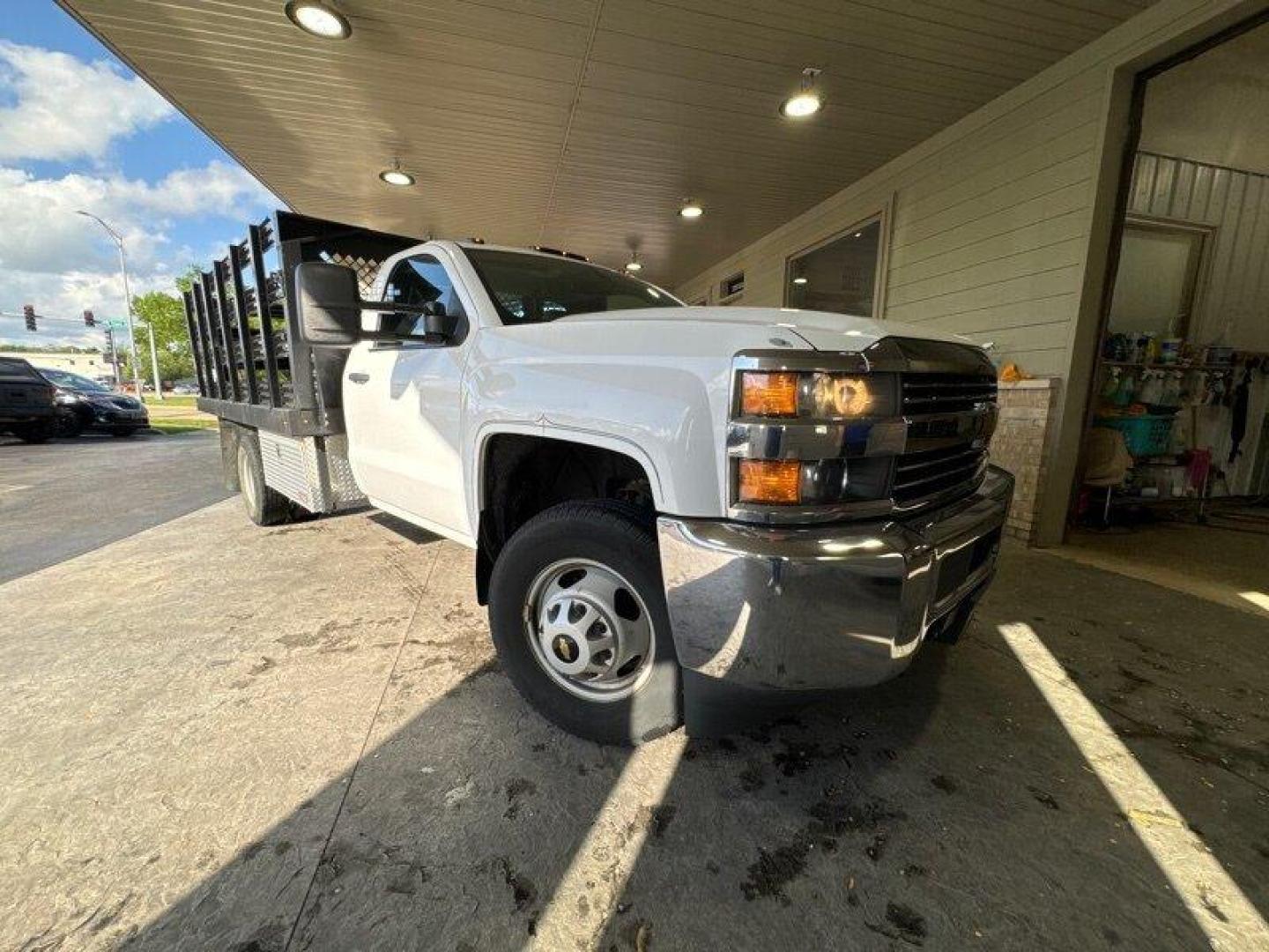 2015 White Chevrolet Silverado 3500HD CC Work Truck (1GB3CYCG4FF) with an 6.0L V8 322hp 380ft. lbs. engine, Automatic transmission, located at 25355 Eames Street, Channahon, IL, 60410, (815) 467-1807, 41.429108, -88.228432 - **11 FOOT MONROE STAKE BODY WITH SIDES** Introducing a sturdy and reliable pickup truck, the 2015 Chevrolet Silverado 3500HD CC Work Truck. This vehicle is equipped with a powerful 6.0L V8 engine that produces 322 horsepower and 380 foot-pounds of torque, making it a great choice for hauling heavy - Photo#0