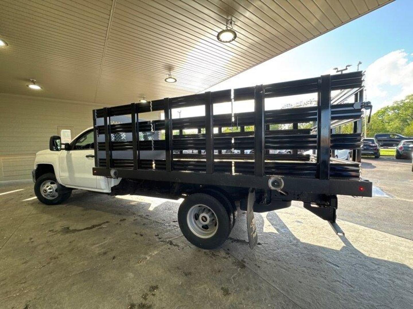 2015 White Chevrolet Silverado 3500HD CC Work Truck (1GB3CYCG4FF) with an 6.0L V8 322hp 380ft. lbs. engine, Automatic transmission, located at 25355 Eames Street, Channahon, IL, 60410, (815) 467-1807, 41.429108, -88.228432 - **11 FOOT MONROE STAKE BODY WITH SIDES** Introducing a sturdy and reliable pickup truck, the 2015 Chevrolet Silverado 3500HD CC Work Truck. This vehicle is equipped with a powerful 6.0L V8 engine that produces 322 horsepower and 380 foot-pounds of torque, making it a great choice for hauling heavy - Photo#5