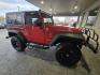 2007 Flame Red Clearcoat Jeep Wrangler Rubicon (1J8GA64197L) with an 3.8L V6 205hp 240ft. lbs. engine, 6 Speed Manual transmission, located at 25355 Eames Street, Channahon, IL, 60410, (815) 467-1807, 41.429108, -88.228432 - This 2007 Jeep Wrangler Rubicon is a top-performing vehicle that boasts a powerful 3.8L V6 205hp 240ft. lbs. engine. With only below 41,000 miles on the odometer, this vehicle has been well-maintained and has an impressive average of less than 3,000 miles per year. The exterior of this Jeep is Flame - Photo#1