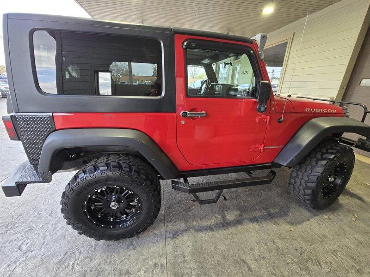 2007 Flame Red Clearcoat Jeep Wrangler Rubicon (1J8GA64197L) with an 3.8L V6 205hp 240ft. lbs. engine, 6 Speed Manual transmission, located at 25355 Eames Street, Channahon, IL, 60410, (815) 467-1807, 41.429108, -88.228432 - This 2007 Jeep Wrangler Rubicon is a top-performing vehicle that boasts a powerful 3.8L V6 205hp 240ft. lbs. engine. With only below 41,000 miles on the odometer, this vehicle has been well-maintained and has an impressive average of less than 3,000 miles per year. The exterior of this Jeep is Flame - Photo#2