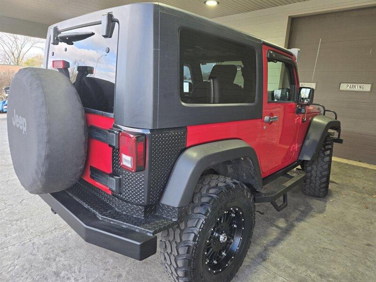 2007 Flame Red Clearcoat Jeep Wrangler Rubicon (1J8GA64197L) with an 3.8L V6 205hp 240ft. lbs. engine, 6 Speed Manual transmission, located at 25355 Eames Street, Channahon, IL, 60410, (815) 467-1807, 41.429108, -88.228432 - This 2007 Jeep Wrangler Rubicon is a top-performing vehicle that boasts a powerful 3.8L V6 205hp 240ft. lbs. engine. With only below 41,000 miles on the odometer, this vehicle has been well-maintained and has an impressive average of less than 3,000 miles per year. The exterior of this Jeep is Flame - Photo#3