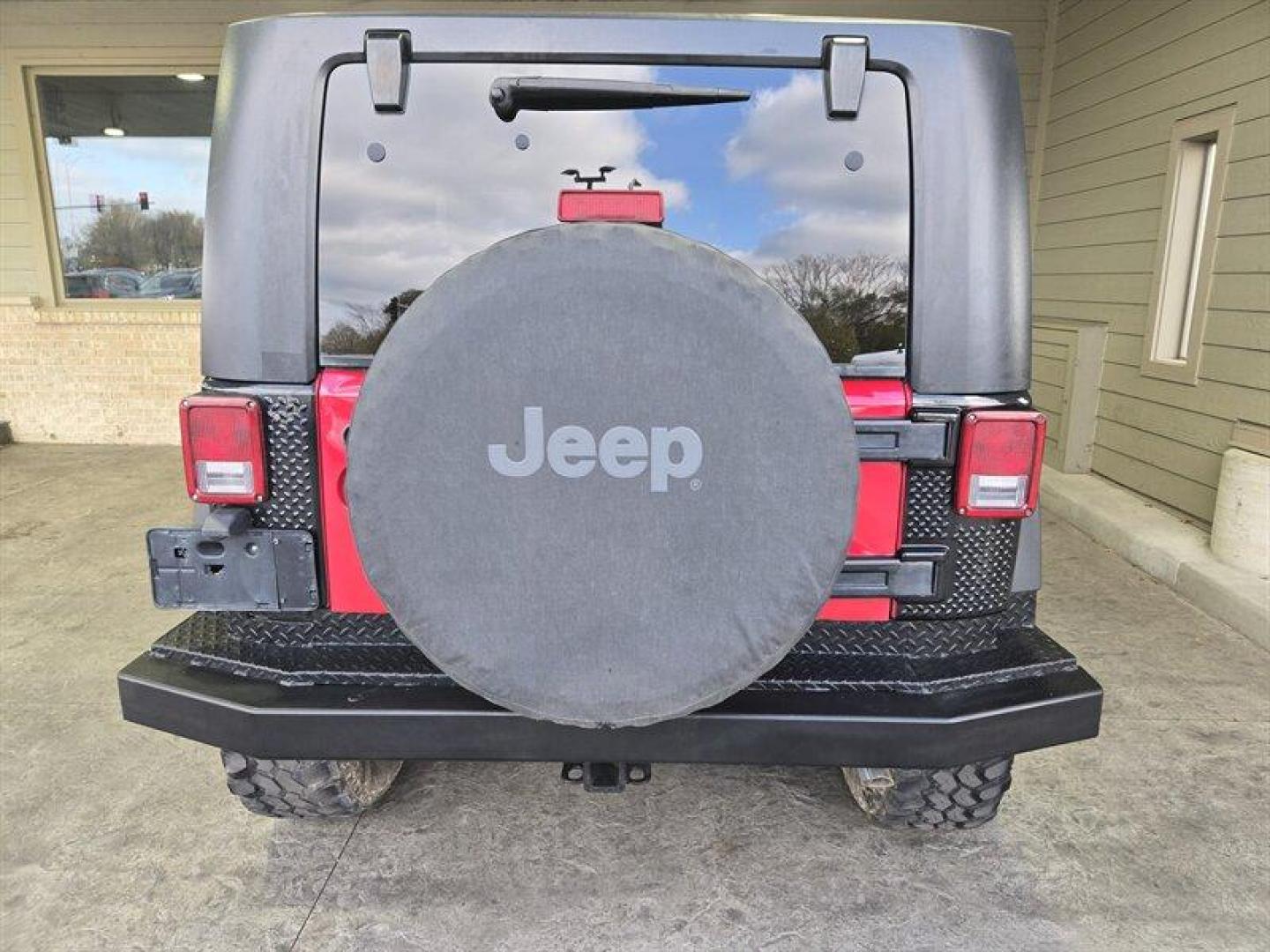 2007 Flame Red Clearcoat Jeep Wrangler Rubicon (1J8GA64197L) with an 3.8L V6 205hp 240ft. lbs. engine, 6 Speed Manual transmission, located at 25355 Eames Street, Channahon, IL, 60410, (815) 467-1807, 41.429108, -88.228432 - This 2007 Jeep Wrangler Rubicon is a top-performing vehicle that boasts a powerful 3.8L V6 205hp 240ft. lbs. engine. With only below 41,000 miles on the odometer, this vehicle has been well-maintained and has an impressive average of less than 3,000 miles per year. The exterior of this Jeep is Flame - Photo#4