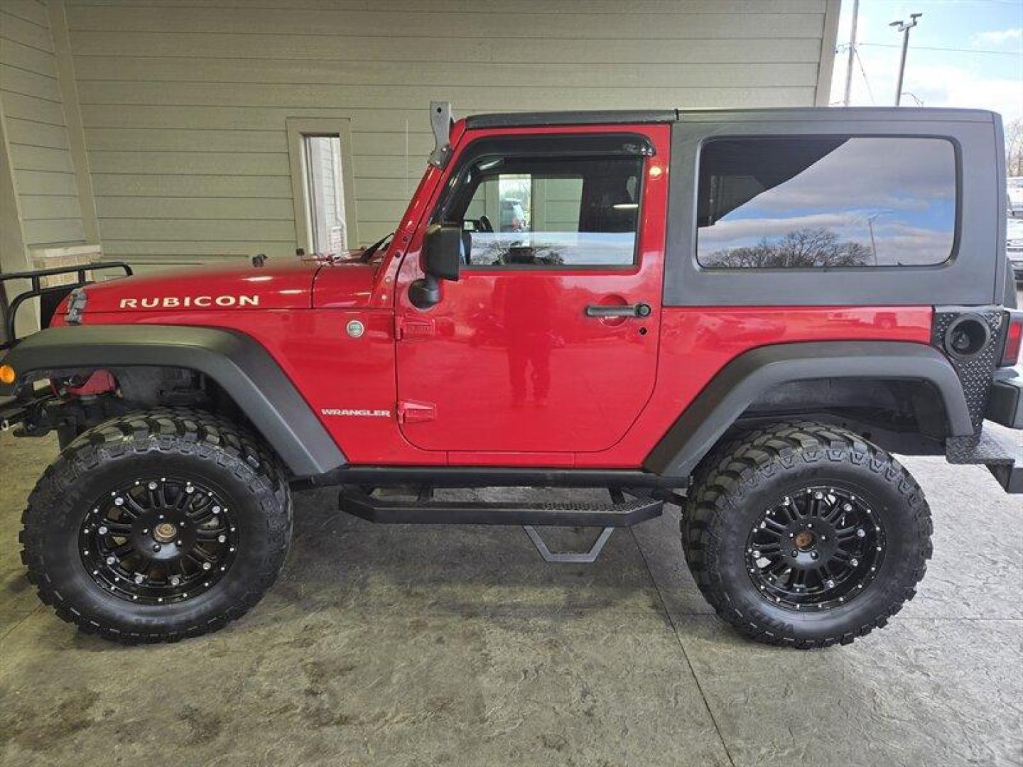 2007 Flame Red Clearcoat Jeep Wrangler Rubicon (1J8GA64197L) with an 3.8L V6 205hp 240ft. lbs. engine, 6 Speed Manual transmission, located at 25355 Eames Street, Channahon, IL, 60410, (815) 467-1807, 41.429108, -88.228432 - This 2007 Jeep Wrangler Rubicon is a top-performing vehicle that boasts a powerful 3.8L V6 205hp 240ft. lbs. engine. With only below 41,000 miles on the odometer, this vehicle has been well-maintained and has an impressive average of less than 3,000 miles per year. The exterior of this Jeep is Flame - Photo#7