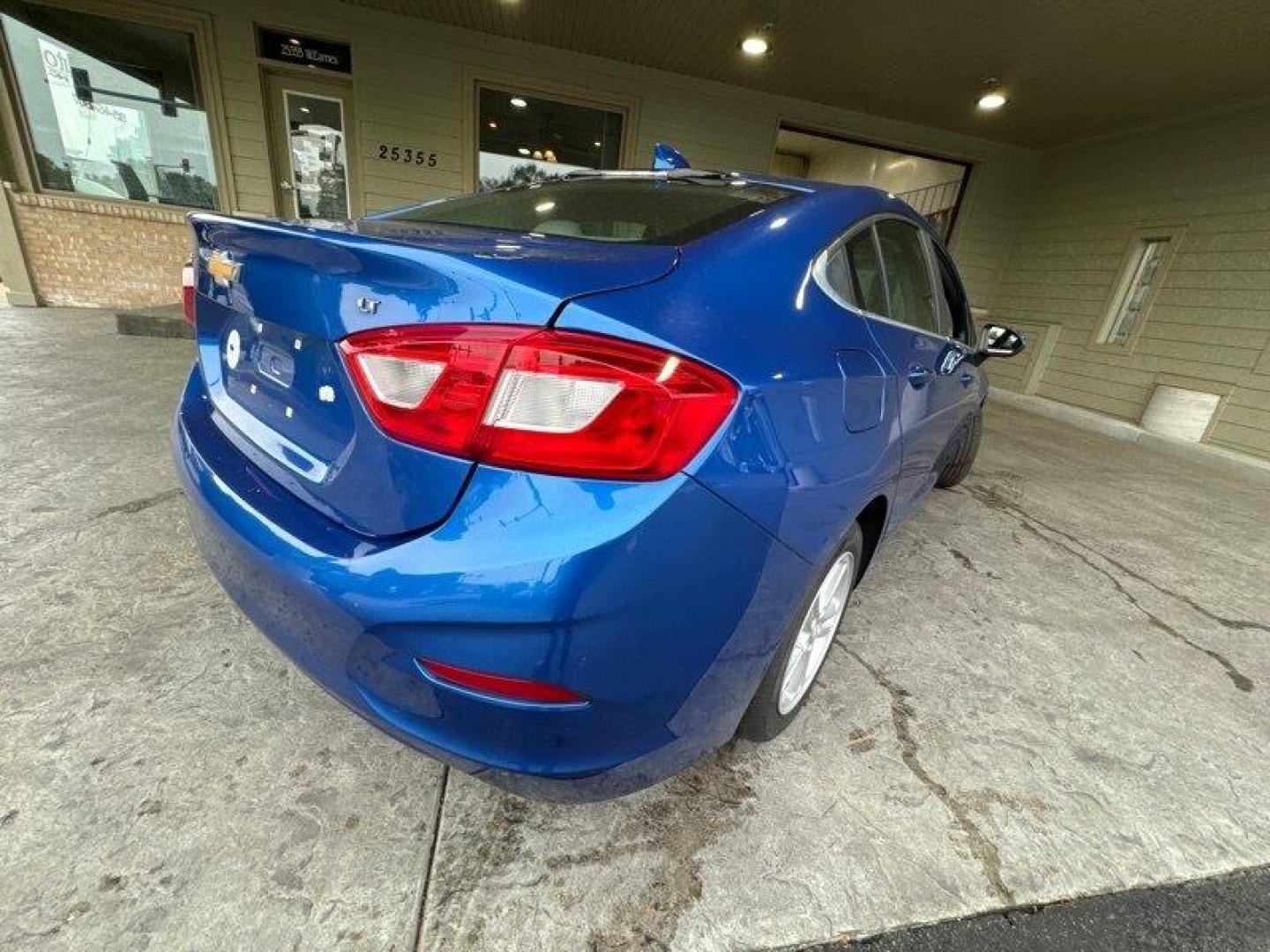 2016 Blue Ray Metallic Chevrolet Cruze LT (1G1BE5SM6G7) with an 1.4L Turbo I4 153hp 177ft. lbs. engine, Automatic transmission, located at 25355 Eames Street, Channahon, IL, 60410, (815) 467-1807, 41.429108, -88.228432 - Looking for a reliable and stylish car that won't break the bank? Look no further than the 2016 Chevrolet Cruze LT Auto! This Blue Ray Metallic beauty is powered by a 1.4L Turbo I4 engine that boasts an impressive 153 horsepower and 177ft. lbs. of torque. This vehicle comes with a range of factory - Photo#2