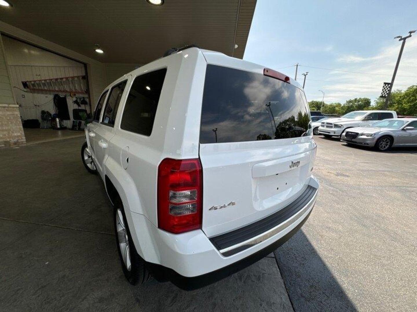 2011 Bright White Clear Coat Jeep Patriot Latitude X (1J4NF4GB2BD) with an 2.4L I4 172hp 165ft. lbs. engine, Automatic transmission, located at 25355 Eames Street, Channahon, IL, 60410, (815) 467-1807, 41.429108, -88.228432 - Looking for a ride that will take you anywhere and everywhere in style? Look no further than the 2011 Jeep Patriot Latitude X! This baby is powered by a 2.4L I4 engine that cranks out a respectable 172 horsepower and 165 foot-pounds of torque. But let's talk about the factory default features, sha - Photo#5