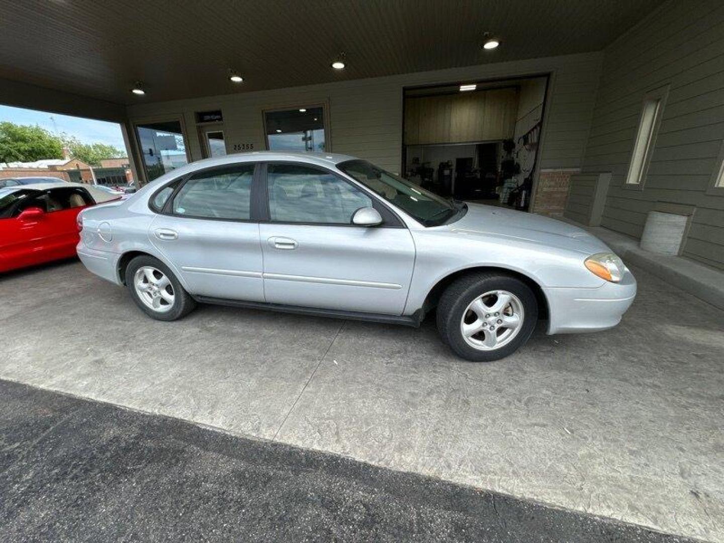 2003 Silver Frost Clearcoat Metallic Ford Taurus SES (1FAFP55U83A) with an 3.0L NA V6 overhead valves (OHV) 12V engine, Automatic transmission, located at 25355 Eames Street, Channahon, IL, 60410, (815) 467-1807, 41.429108, -88.228432 - Looking for a ride that's both stylish and practical? Look no further than this 2003 Ford Taurus SES! With its sleek design and powerful 3.0L NA V6 overhead valves (OHV) 12V engine, this baby is sure to turn heads. And with less than 59,000 miles on the odometer, you'll be cruising in style for year - Photo#1