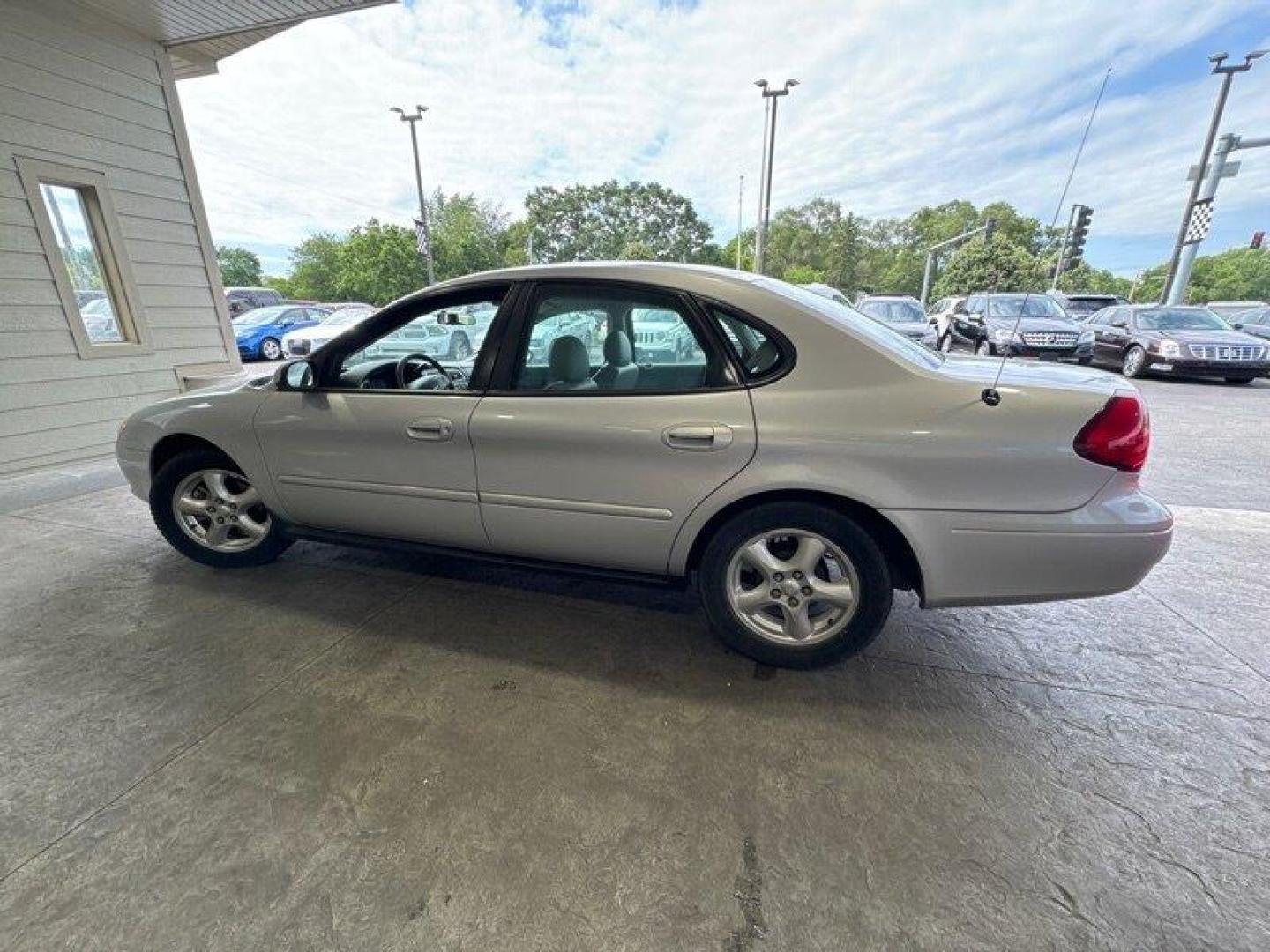 2003 Silver Frost Clearcoat Metallic Ford Taurus SES (1FAFP55U83A) with an 3.0L NA V6 overhead valves (OHV) 12V engine, Automatic transmission, located at 25355 Eames Street, Channahon, IL, 60410, (815) 467-1807, 41.429108, -88.228432 - Looking for a ride that's both stylish and practical? Look no further than this 2003 Ford Taurus SES! With its sleek design and powerful 3.0L NA V6 overhead valves (OHV) 12V engine, this baby is sure to turn heads. And with less than 59,000 miles on the odometer, you'll be cruising in style for year - Photo#6