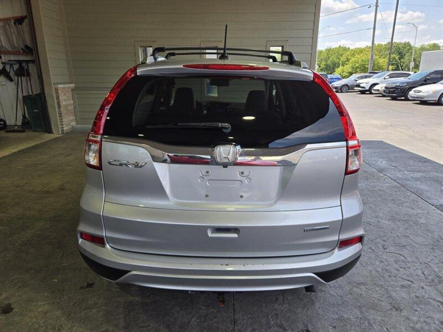 2015 Alabaster Silver Metallic Honda CR-V Touring (5J6RM3H98FL) with an 2.4L I4 185hp 181ft. lbs. engine, Automatic transmission, located at 25355 Eames Street, Channahon, IL, 60410, (815) 467-1807, 41.429108, -88.228432 - Oh honey, have we got a treat for you! Feast your eyes on the sleek and sexy 2015 Honda CR-V Touring in Alabaster Silver Metallic with a stunning Gray interior. This baby is powered by a fierce 2.4L I4 engine, giving you a whopping 185hp and 181ft. lbs. of torque. But wait, there's more! This bad - Photo#4