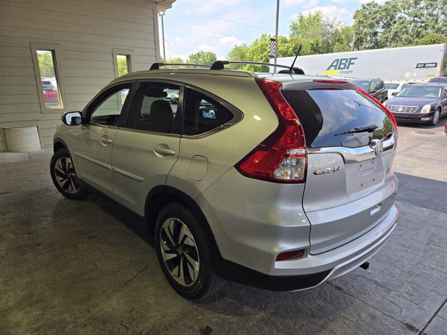 2015 Alabaster Silver Metallic Honda CR-V Touring (5J6RM3H98FL) with an 2.4L I4 185hp 181ft. lbs. engine, Automatic transmission, located at 25355 Eames Street, Channahon, IL, 60410, (815) 467-1807, 41.429108, -88.228432 - Oh honey, have we got a treat for you! Feast your eyes on the sleek and sexy 2015 Honda CR-V Touring in Alabaster Silver Metallic with a stunning Gray interior. This baby is powered by a fierce 2.4L I4 engine, giving you a whopping 185hp and 181ft. lbs. of torque. But wait, there's more! This bad - Photo#5