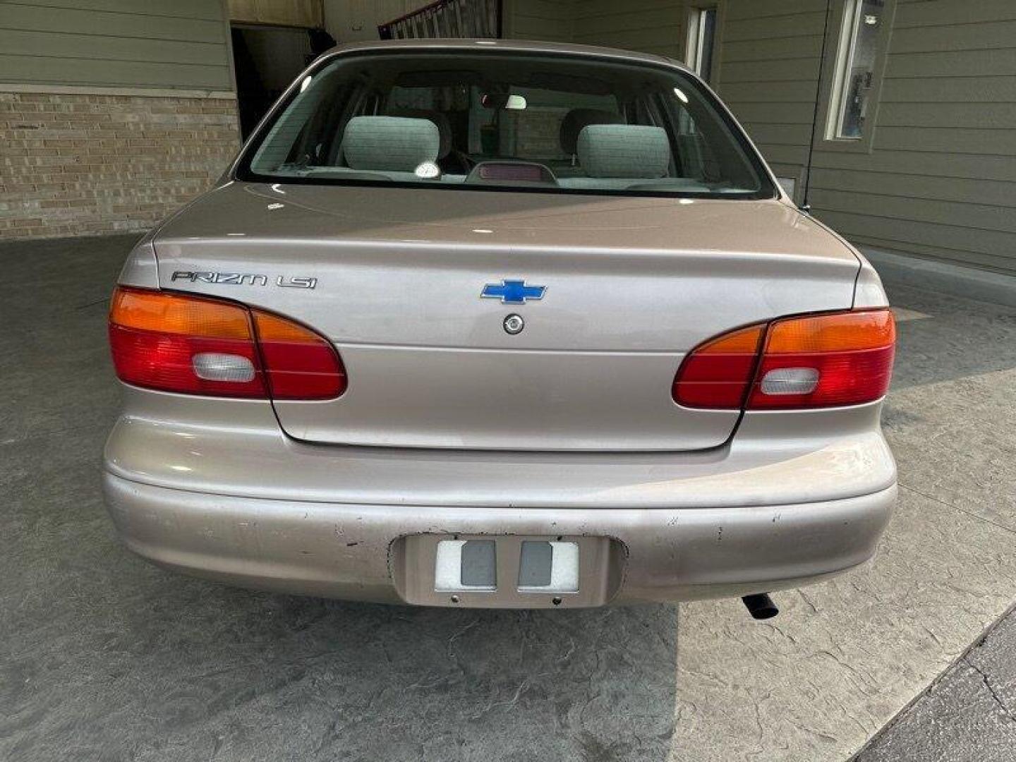 1998 Tan Chevrolet Prizm LSi (1Y1SK5288WZ) with an 1L NA I4 double overhead cam (DOHC) 16V engine, Automatic transmission, located at 25355 Eames Street, Channahon, IL, 60410, (815) 467-1807, 41.429108, -88.228432 - Looking for a car that can take you from point A to point B without breaking the bank? Look no further than the 1998 Chevrolet Prizm! This little guy is powered by a 1L NA I4 double overhead cam (DOHC) 16V engine that will get you where you need to go without burning a hole in your wallet. But that - Photo#4