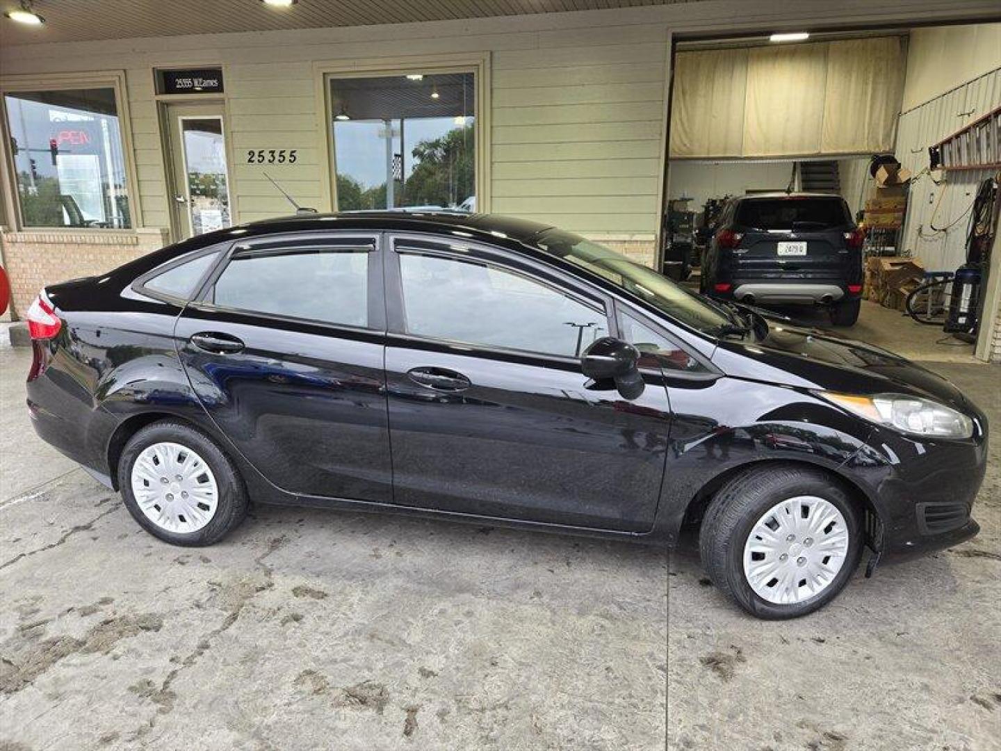 2018 Shadow Black Ford Fiesta S (3FADP4AJ2JM) with an 1.6L I4 120hp 112ft. lbs. engine, 5 Speed Manual transmission, located at 25355 Eames Street, Channahon, IL, 60410, (815) 467-1807, 41.429108, -88.228432 - Looking for a fun and stylish ride that won't break the bank? Look no further than the 2018 Ford Fiesta S! This compact car packs a punch with its 1.6L I4 engine, producing 120 horsepower and 112 foot-pounds of torque. And with its impressive fuel efficiency of 27 MPG in the city and 35 MPG on the h - Photo#2