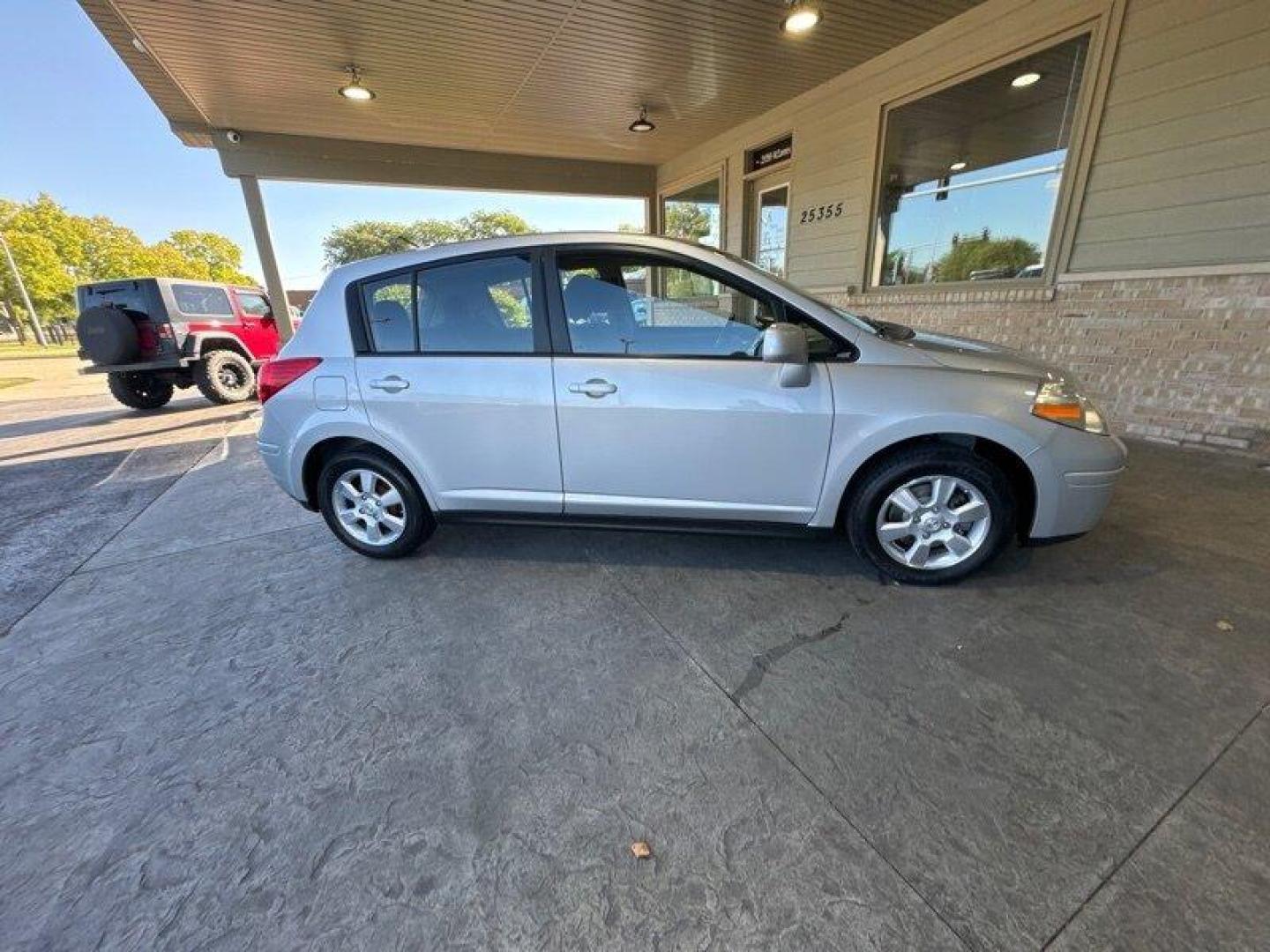 2012 Brilliant Silver Nissan Versa 1.8 S (3N1BC1CP2CK) with an 1.8L I4 122hp 127ft. lbs. engine, Automatic transmission, located at 25355 Eames Street, Channahon, IL, 60410, (815) 467-1807, 41.429108, -88.228432 - Looking for a car that's efficient, reliable, and doesn't break the bank? Look no further than the 2012 Nissan Versa 1.8 S! This baby is powered by a 1.8L I4 122hp 127ft. lbs. engine, which means it's got some pep in its step but won't guzzle gas like a frat boy at a kegger. Speaking of gas, you'll - Photo#2