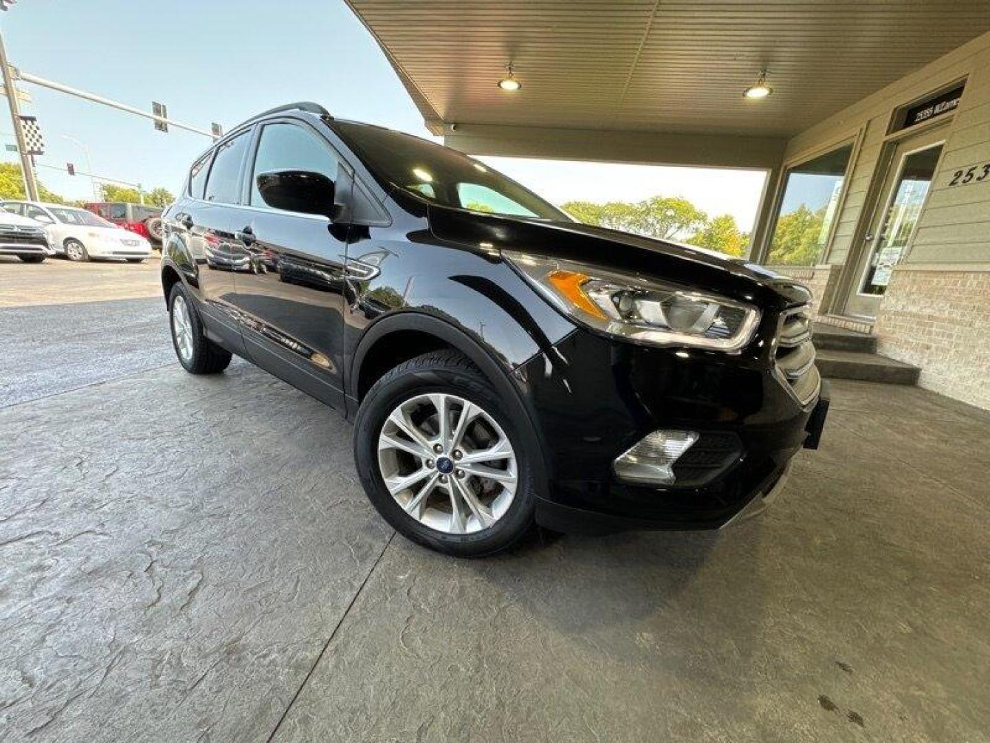 2018 Shadow Black Ford Escape SEL (1FMCU0HD3JU) with an EcoBoost 1.5L Turbo I4 179hp 177ft. lbs. engine, Automatic transmission, located at 25355 Eames Street, Channahon, IL, 60410, (815) 467-1807, 41.429108, -88.228432 - Introducing the stunning 2018 Ford Escape SEL, a vehicle that is sure to turn heads wherever you go! With its powerful EcoBoost 1.5L Turbo I4 179hp 177ft. lbs. engine, this SUV is designed to provide an exhilarating driving experience that will leave you wanting more. The factory default features - Photo#0