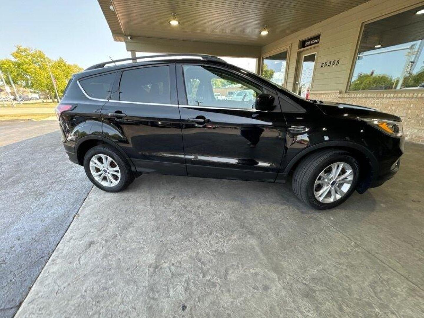 2018 Shadow Black Ford Escape SEL (1FMCU0HD3JU) with an EcoBoost 1.5L Turbo I4 179hp 177ft. lbs. engine, Automatic transmission, located at 25355 Eames Street, Channahon, IL, 60410, (815) 467-1807, 41.429108, -88.228432 - Introducing the stunning 2018 Ford Escape SEL, a vehicle that is sure to turn heads wherever you go! With its powerful EcoBoost 1.5L Turbo I4 179hp 177ft. lbs. engine, this SUV is designed to provide an exhilarating driving experience that will leave you wanting more. The factory default features - Photo#1