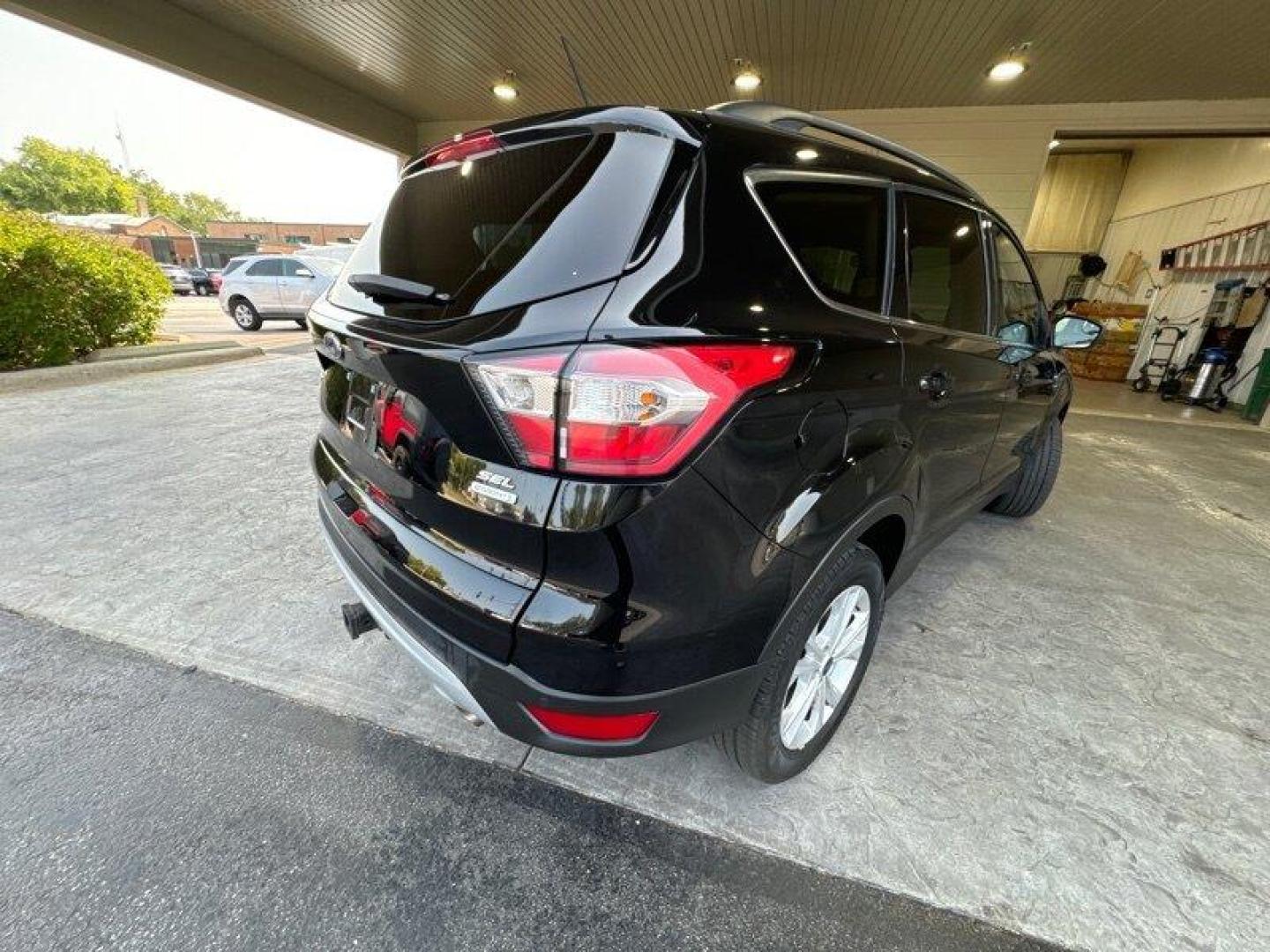 2018 Shadow Black Ford Escape SEL (1FMCU0HD3JU) with an EcoBoost 1.5L Turbo I4 179hp 177ft. lbs. engine, Automatic transmission, located at 25355 Eames Street, Channahon, IL, 60410, (815) 467-1807, 41.429108, -88.228432 - Introducing the stunning 2018 Ford Escape SEL, a vehicle that is sure to turn heads wherever you go! With its powerful EcoBoost 1.5L Turbo I4 179hp 177ft. lbs. engine, this SUV is designed to provide an exhilarating driving experience that will leave you wanting more. The factory default features - Photo#3