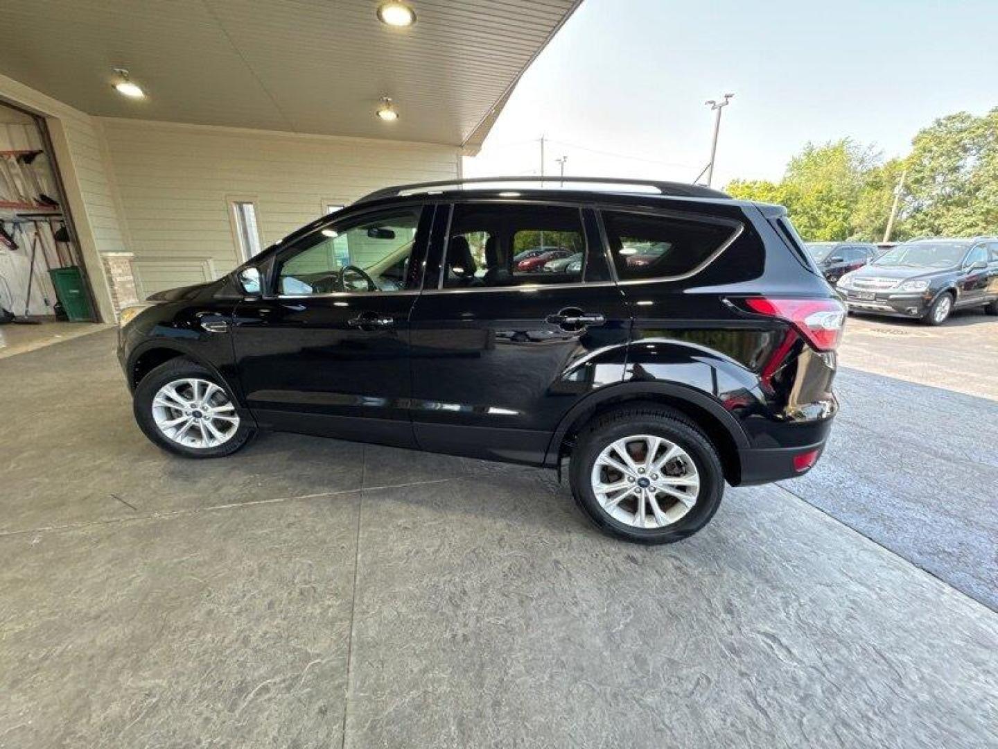 2018 Shadow Black Ford Escape SEL (1FMCU0HD3JU) with an EcoBoost 1.5L Turbo I4 179hp 177ft. lbs. engine, Automatic transmission, located at 25355 Eames Street, Channahon, IL, 60410, (815) 467-1807, 41.429108, -88.228432 - Introducing the stunning 2018 Ford Escape SEL, a vehicle that is sure to turn heads wherever you go! With its powerful EcoBoost 1.5L Turbo I4 179hp 177ft. lbs. engine, this SUV is designed to provide an exhilarating driving experience that will leave you wanting more. The factory default features - Photo#6