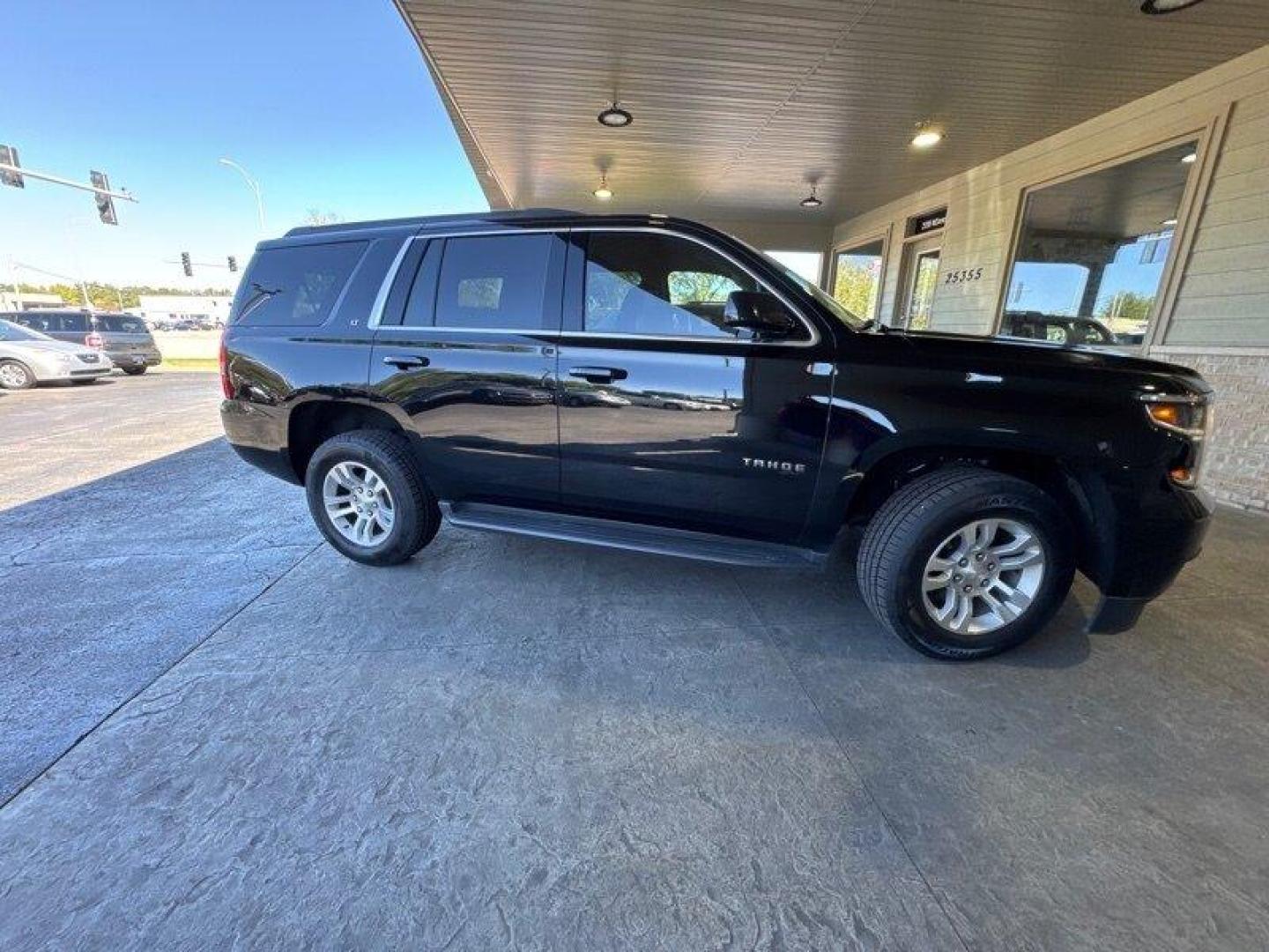 2017 Black Chevrolet Tahoe LT (1GNSKBKC1HR) with an EcoTec3 5.3L Flex Fuel V8 355hp 383ft. lbs. engine, Automatic transmission, located at 25355 Eames Street, Channahon, IL, 60410, (815) 467-1807, 41.429108, -88.228432 - Looking for a bold, badass SUV that can handle anything life throws your way? Look no further than the 2017 Chevrolet Tahoe LT, baby! This bad boy is powered by a beastly EcoTec3 5.3L Flex Fuel V8 engine, delivering a whopping 355 horsepower and 383 foot-pounds of torque. That means you'll be able t - Photo#1