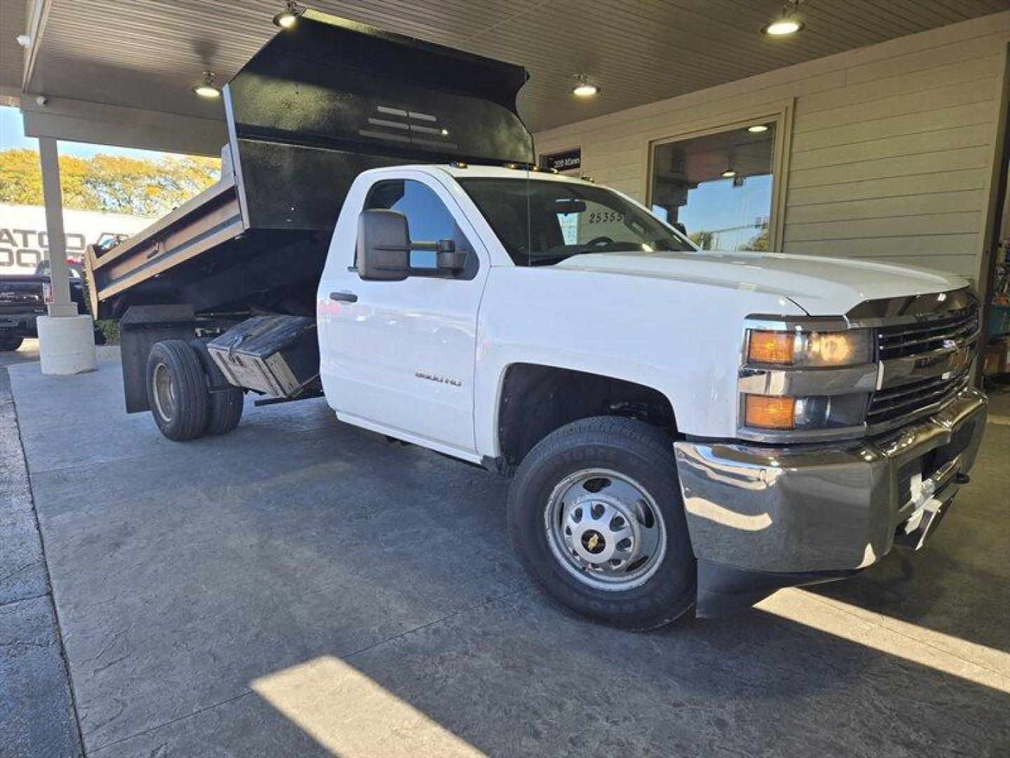 2015 White Chevrolet Silverado 3500 Work Truck (1GB3CYCGXFF) with an 6.0L V8 322hp 380ft. lbs. engine, located at 25355 Eames Street, Channahon, IL, 60410, (815) 467-1807, 41.429108, -88.228432 - ** MONROE 11 FOOT DUMP BODY. ** Introducing a 2015 Chevrolet Silverado 3500 Work Truck with a powerful 6.0L V8 engine that delivers 322 horsepower and 380 ft. lbs. of torque. This vehicle is equipped with factory default features that provide a comfortable and practical driving experience. The exte - Photo#0