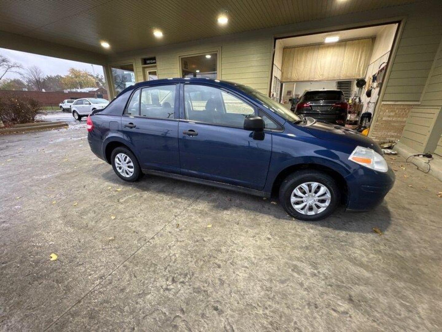 2009 Blue Onyx Nissan Versa 1.6 (3N1CC11EX9L) with an 1.6L I4 107hp 111ft. lbs. engine, Automatic transmission, located at 25355 Eames Street, Channahon, IL, 60410, (815) 467-1807, 41.429108, -88.228432 - Looking for a reliable and efficient car that won't break the bank? Look no further than this 2009 Nissan Versa 1.6 Base! Powered by a 1.6L I4 engine with 107 horsepower and 111 ft. lbs. of torque, this car will get you where you need to go with ease. But what really sets this car apart are its fac - Photo#1