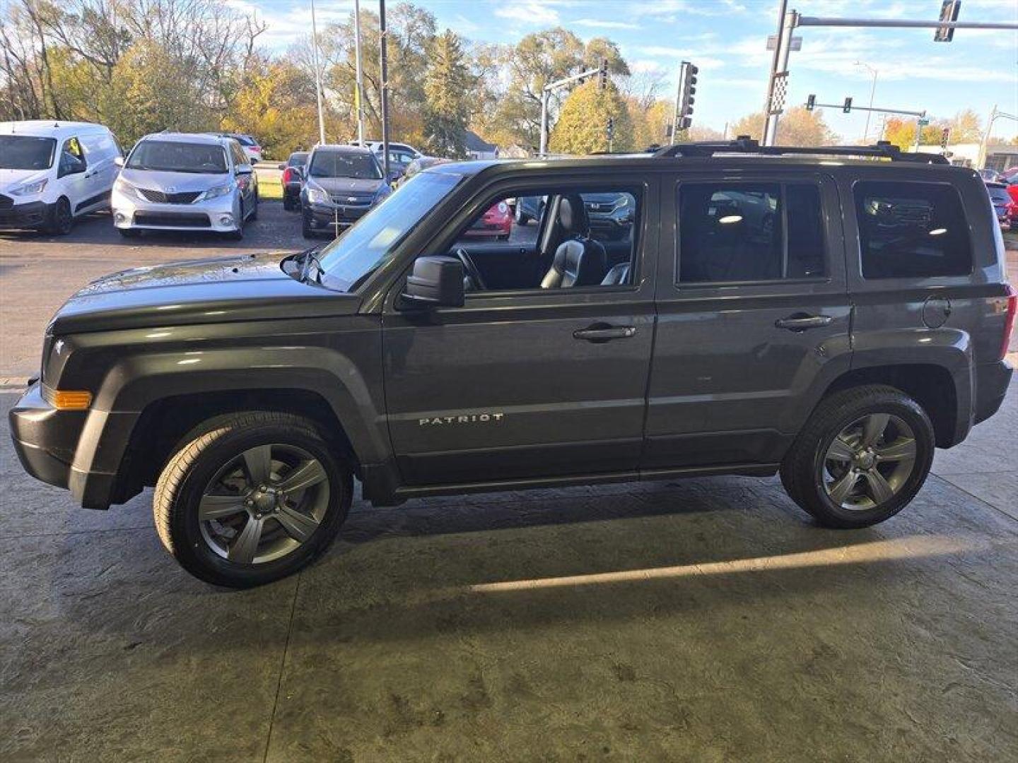 2015 Granite Crystal Metallic Clear Coat Jeep Patriot High Altitude (1C4NJRFB7FD) with an 2.4L I4 172hp 165ft. lbs. engine, Automatic transmission, located at 25355 Eames Street, Channahon, IL, 60410, (815) 467-1807, 41.429108, -88.228432 - Introducing a 2015 Jeep Patriot High Altitude in Granite Crystal Metallic Clear Coat with a Dark Slate Gray interior. This SUV is powered by a 2.4L I4 172hp 165ft. lbs. engine and has an impressive mileage of below 69,000 miles, averaging less than 7,000 miles per year. This vehicle offers a great c - Photo#7