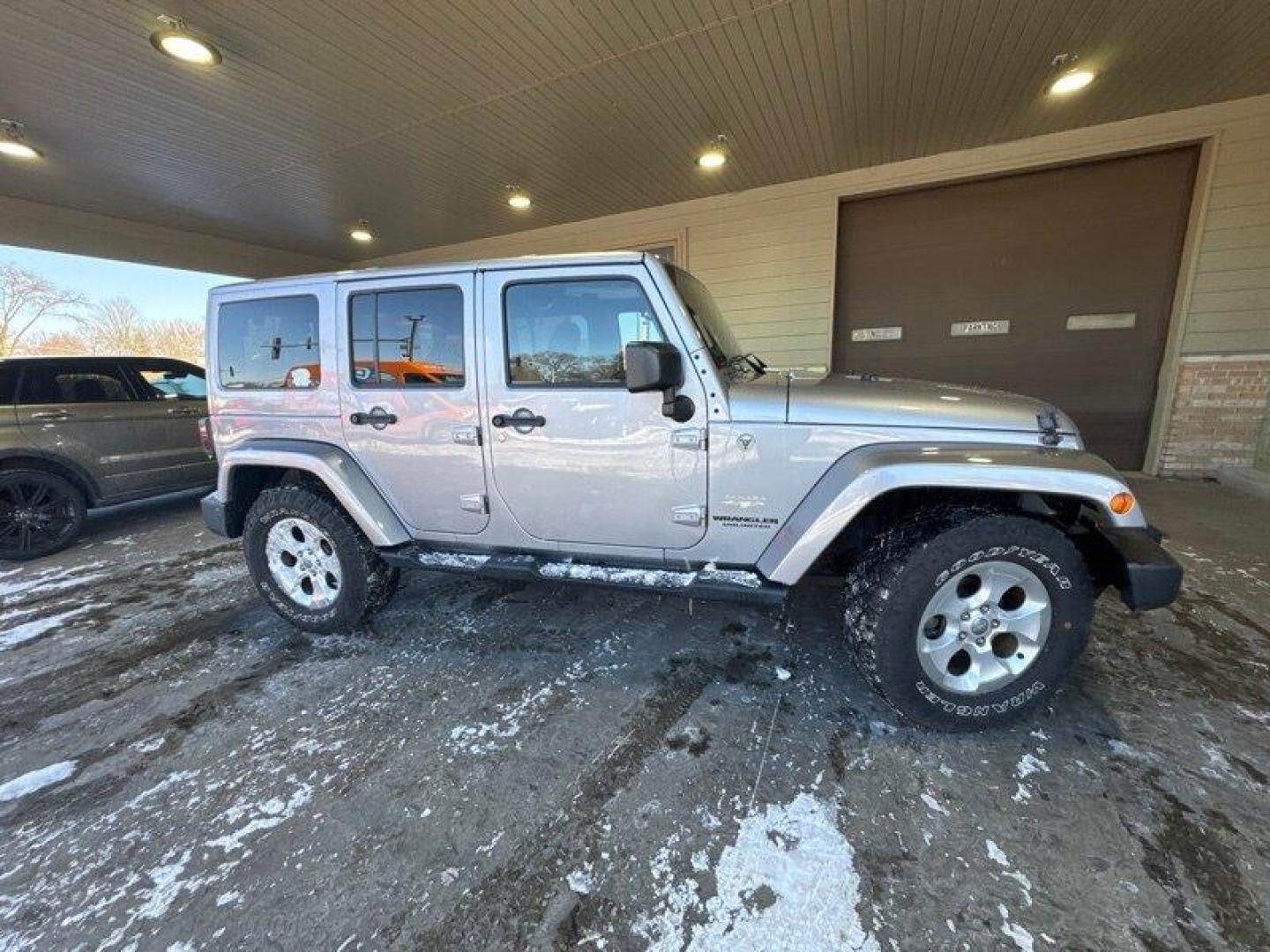 2014 Billet Silver Metallic Clear Coat Jeep Wrangler Unlimited Sahara (1C4BJWEG2EL) with an 3.6L V6 285hp 260ft. lbs. engine, located at 25355 Eames Street, Channahon, IL, 60410, (815) 467-1807, 41.429108, -88.228432 - Introducing the 2014 Jeep Wrangler Unlimited Sahara! This rugged and powerful SUV is ready for any adventure you can throw at it. Powered by a 3.6L V6 engine that produces 285 horsepower and 260 foot-pounds of torque, this Wrangler is built to handle any challenge. The exterior of this Wrangler is - Photo#1