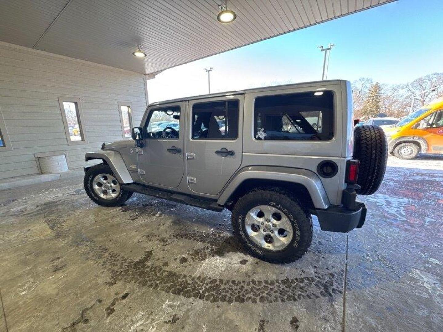 2014 Billet Silver Metallic Clear Coat Jeep Wrangler Unlimited Sahara (1C4BJWEG2EL) with an 3.6L V6 285hp 260ft. lbs. engine, located at 25355 Eames Street, Channahon, IL, 60410, (815) 467-1807, 41.429108, -88.228432 - Introducing the 2014 Jeep Wrangler Unlimited Sahara! This rugged and powerful SUV is ready for any adventure you can throw at it. Powered by a 3.6L V6 engine that produces 285 horsepower and 260 foot-pounds of torque, this Wrangler is built to handle any challenge. The exterior of this Wrangler is - Photo#5